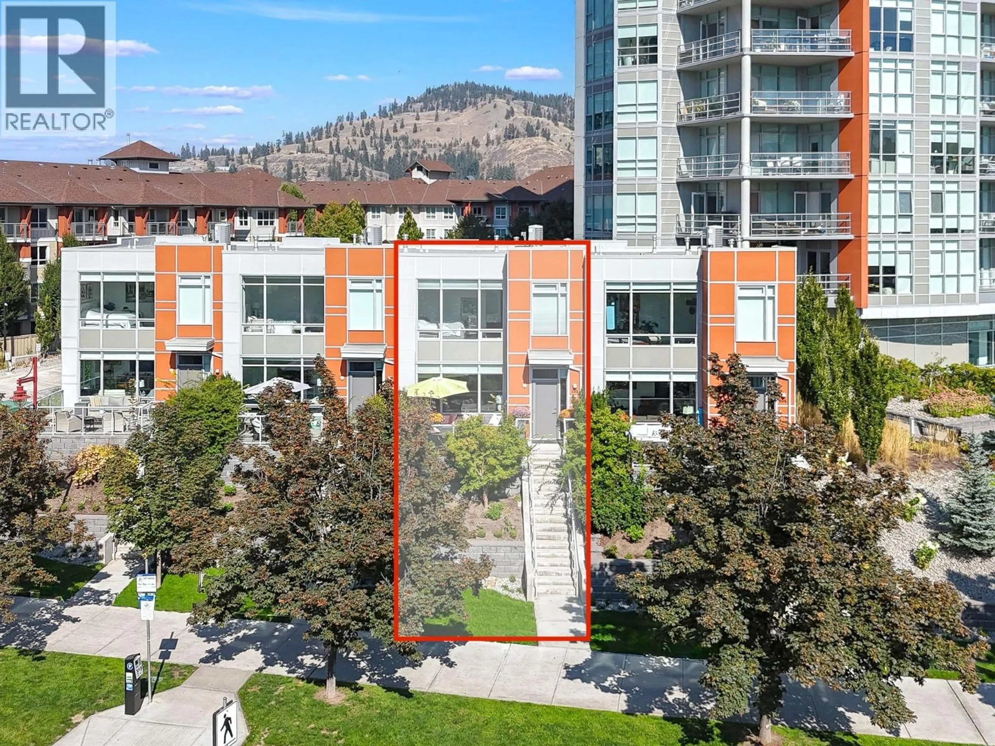 A pic from outside/outdoor area/front of a property/back of a property/a pic from drone, mountain view for 103 - 1151 SUNSET DRIVE, Kelowna British Columbia V1Y0G2