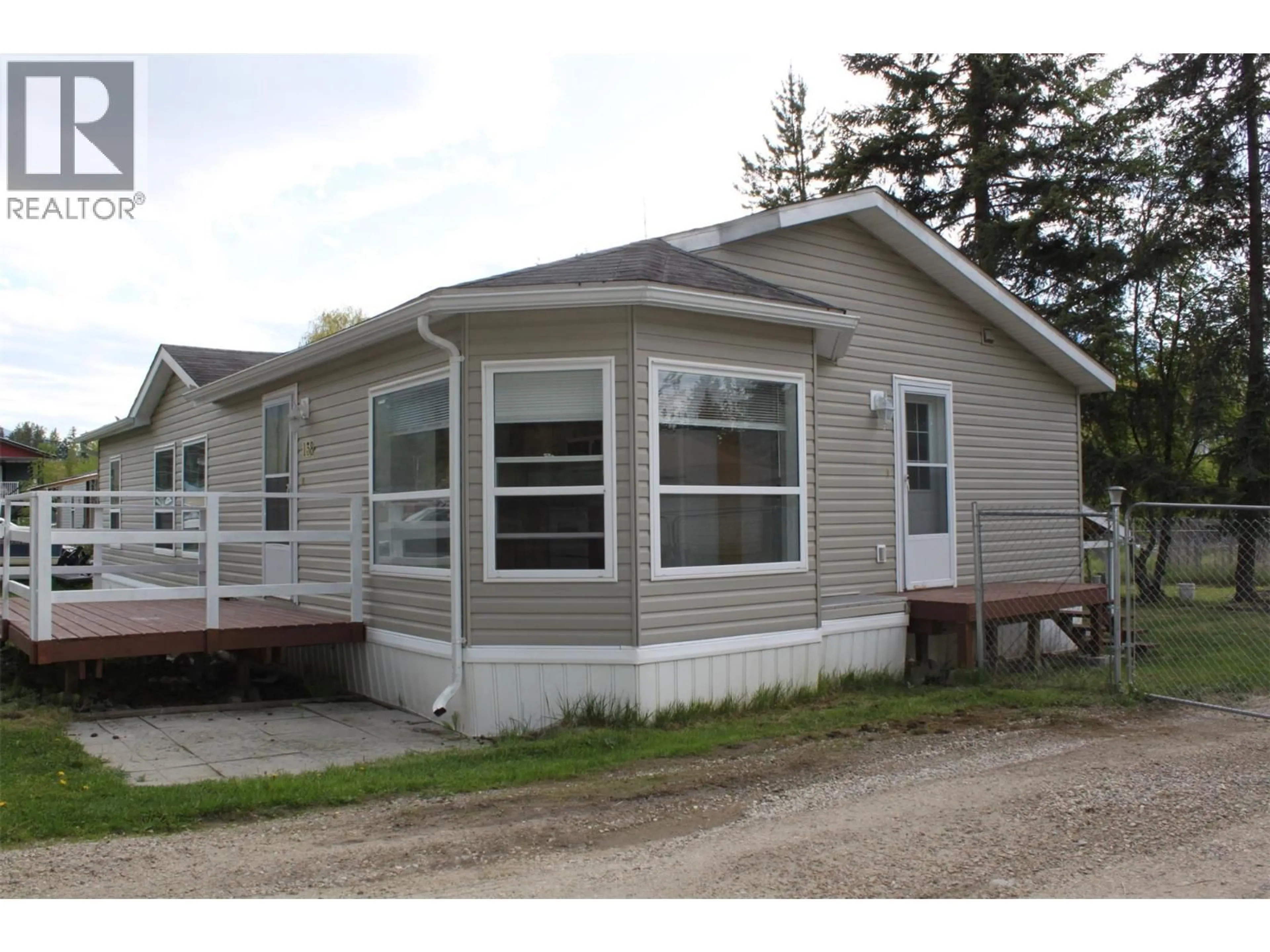 Home with vinyl exterior material, street for 138 COTSWOLD ROAD, Nakusp British Columbia V0G1R0