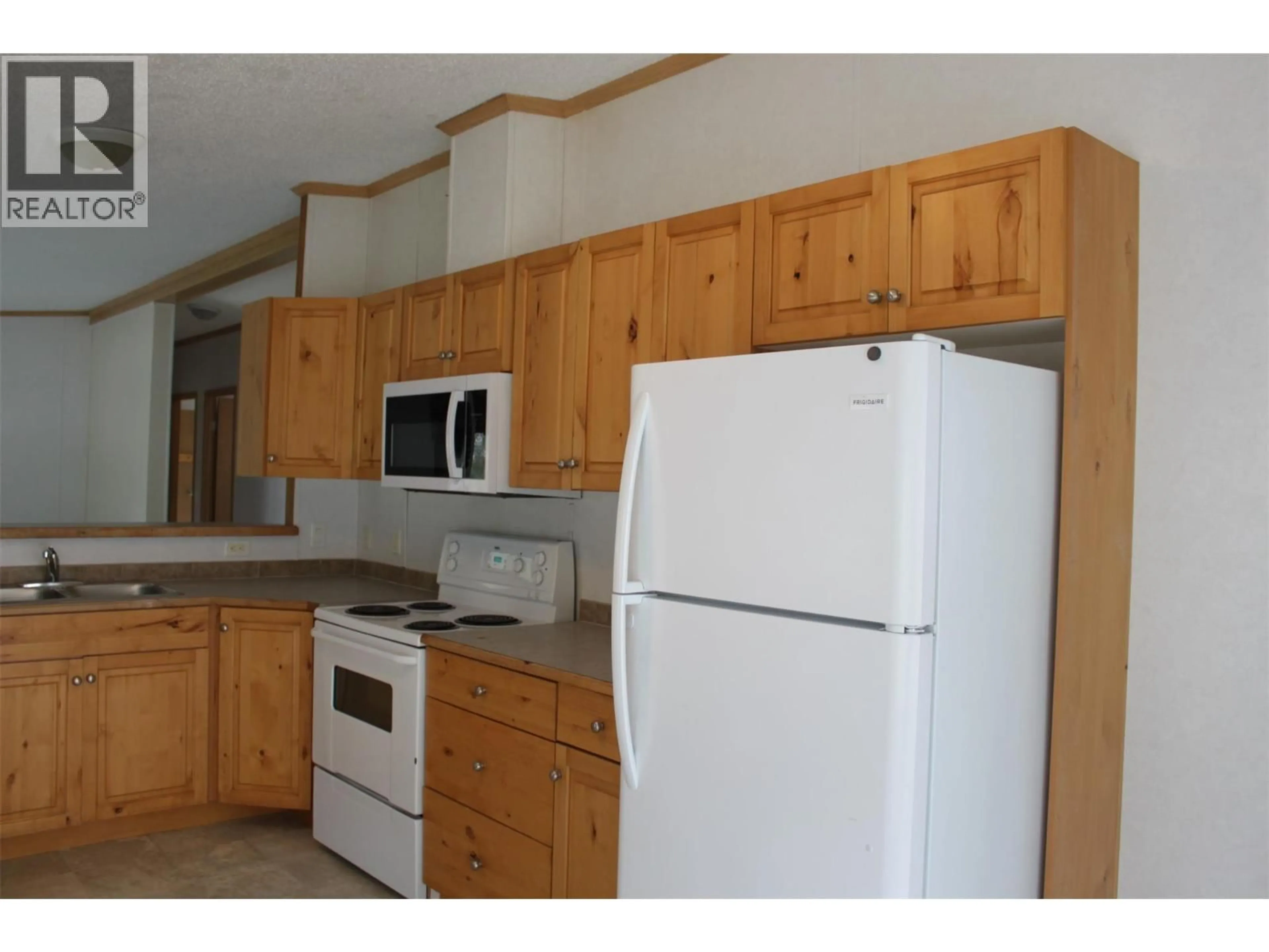 Standard kitchen, wood/laminate floor for 138 COTSWOLD ROAD, Nakusp British Columbia V0G1R0