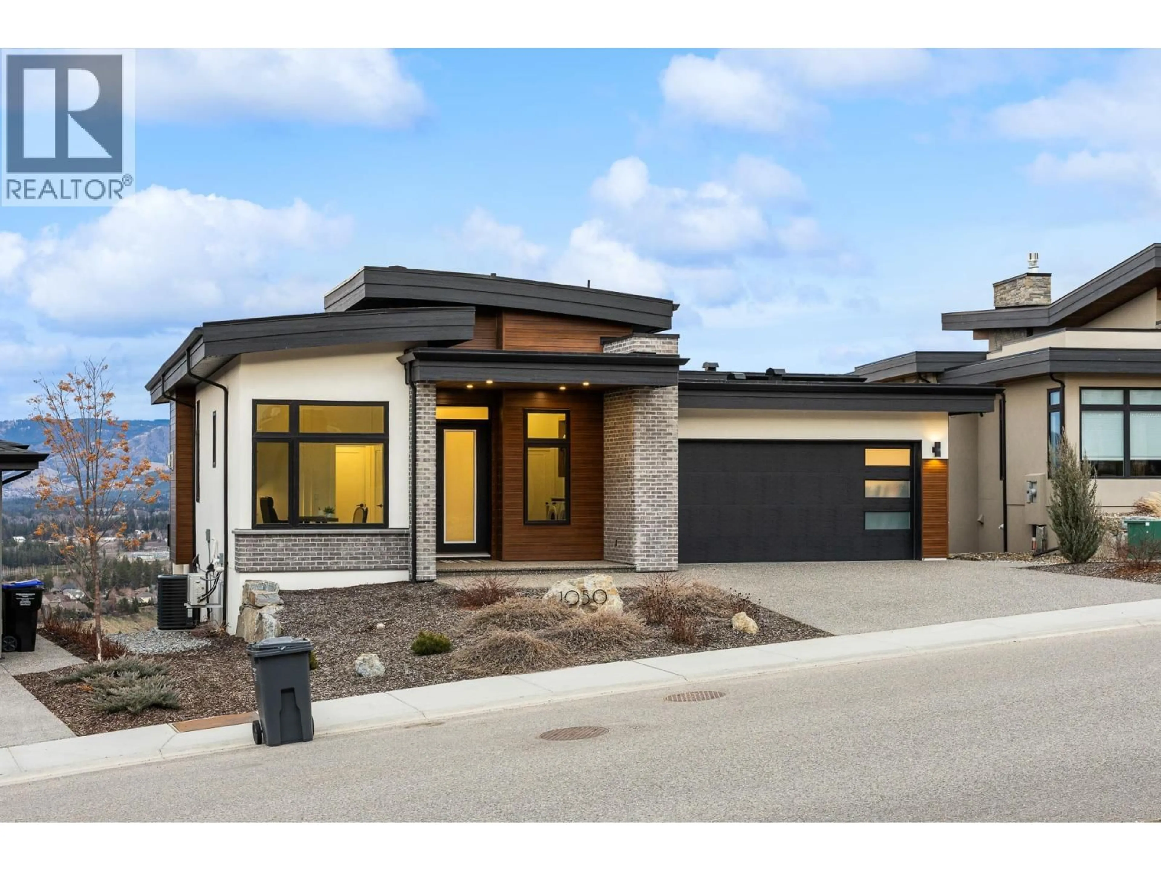 Home with brick exterior material, street for 1050 EMSLIE STREET, Kelowna British Columbia V1W0C3