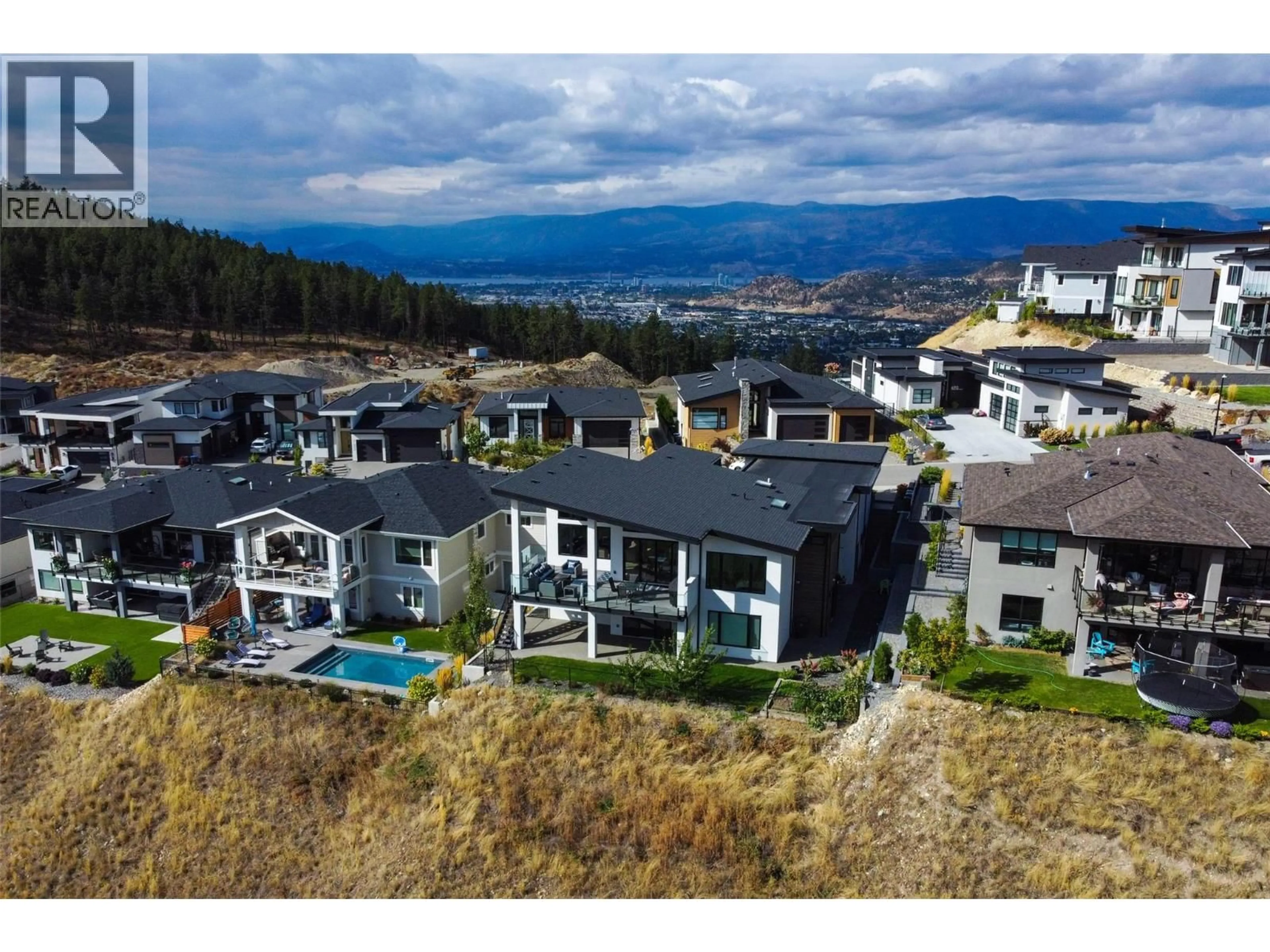 A pic from outside/outdoor area/front of a property/back of a property/a pic from drone, mountain view for 703 CARNOUSTIE DRIVE, Kelowna British Columbia V1P1V2