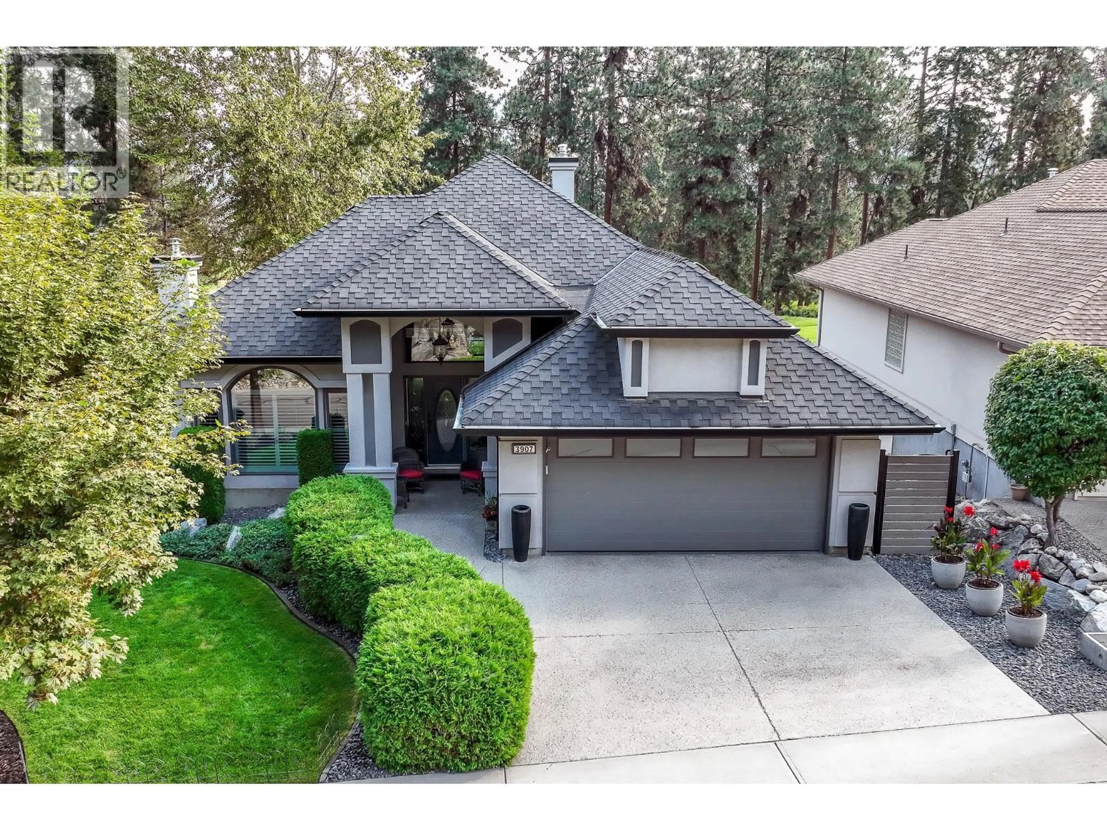 A pic from outside/outdoor area/front of a property/back of a property/a pic from drone, street for 3907 GALLAGHERS CIRCLE, Kelowna British Columbia V1W3Z9