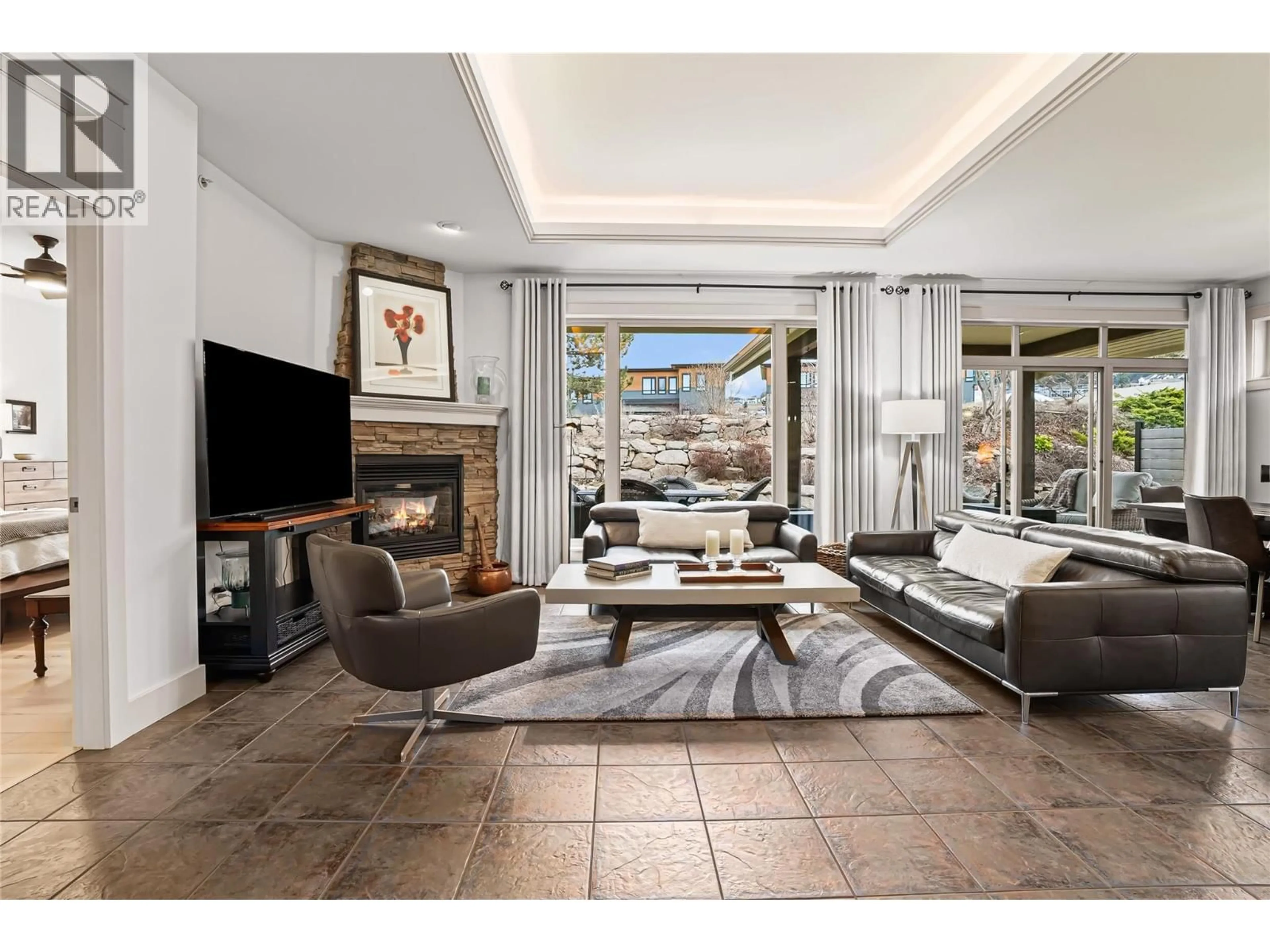 Living room with furniture, ceramic/tile floor for 133 MASHIE CRESCENT, Vernon British Columbia V1H1V8