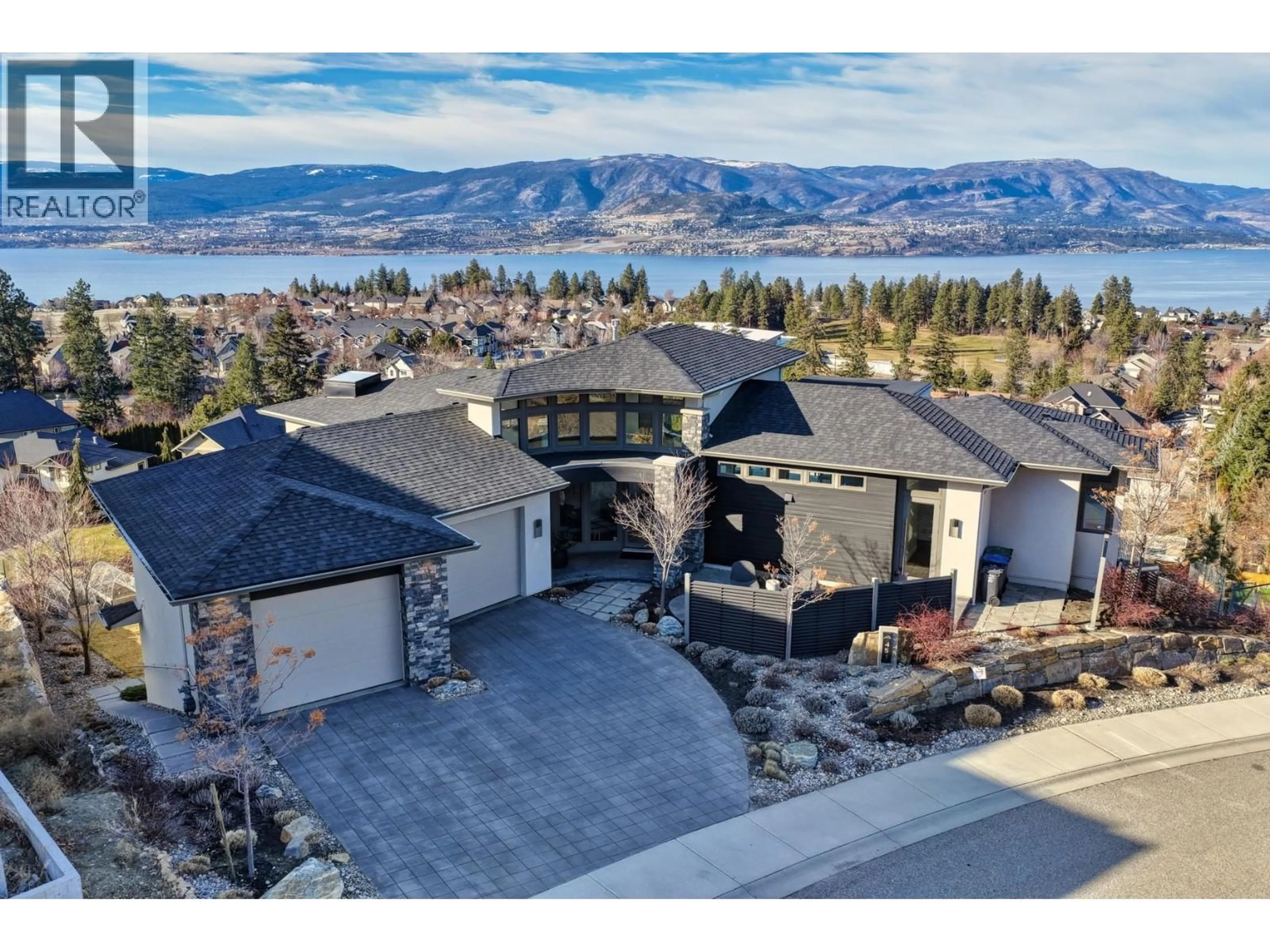 A pic from outside/outdoor area/front of a property/back of a property/a pic from drone, mountain view for 451 SWAN DRIVE, Kelowna British Columbia V1W5L9