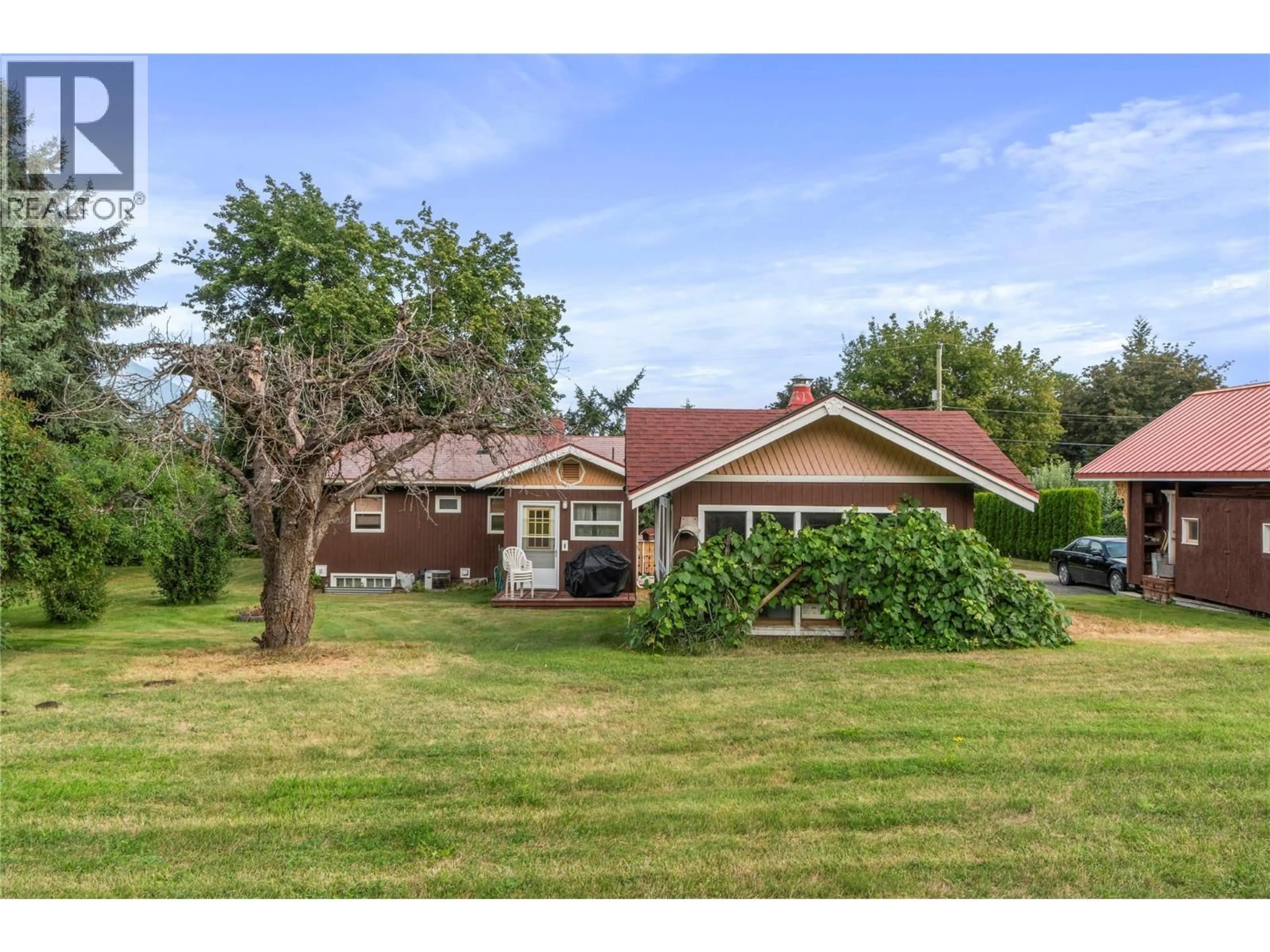 A pic from outside/outdoor area/front of a property/back of a property/a pic from drone, street for 1080 20 AVENUE SOUTHWEST, Salmon Arm British Columbia V1E1L6