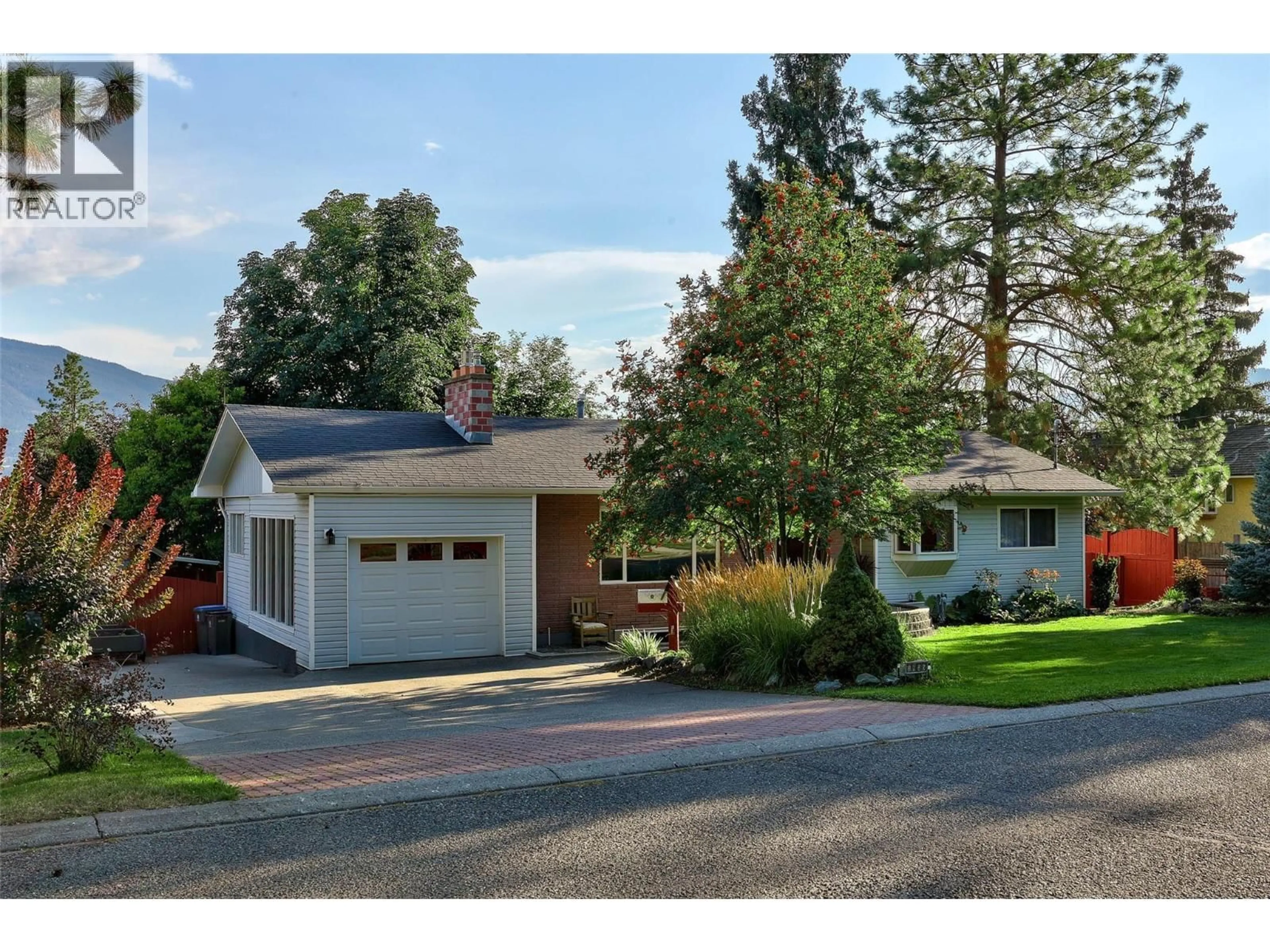 Home with vinyl exterior material, street for 1926 GREAVES AVENUE, Merritt British Columbia V1K1J3