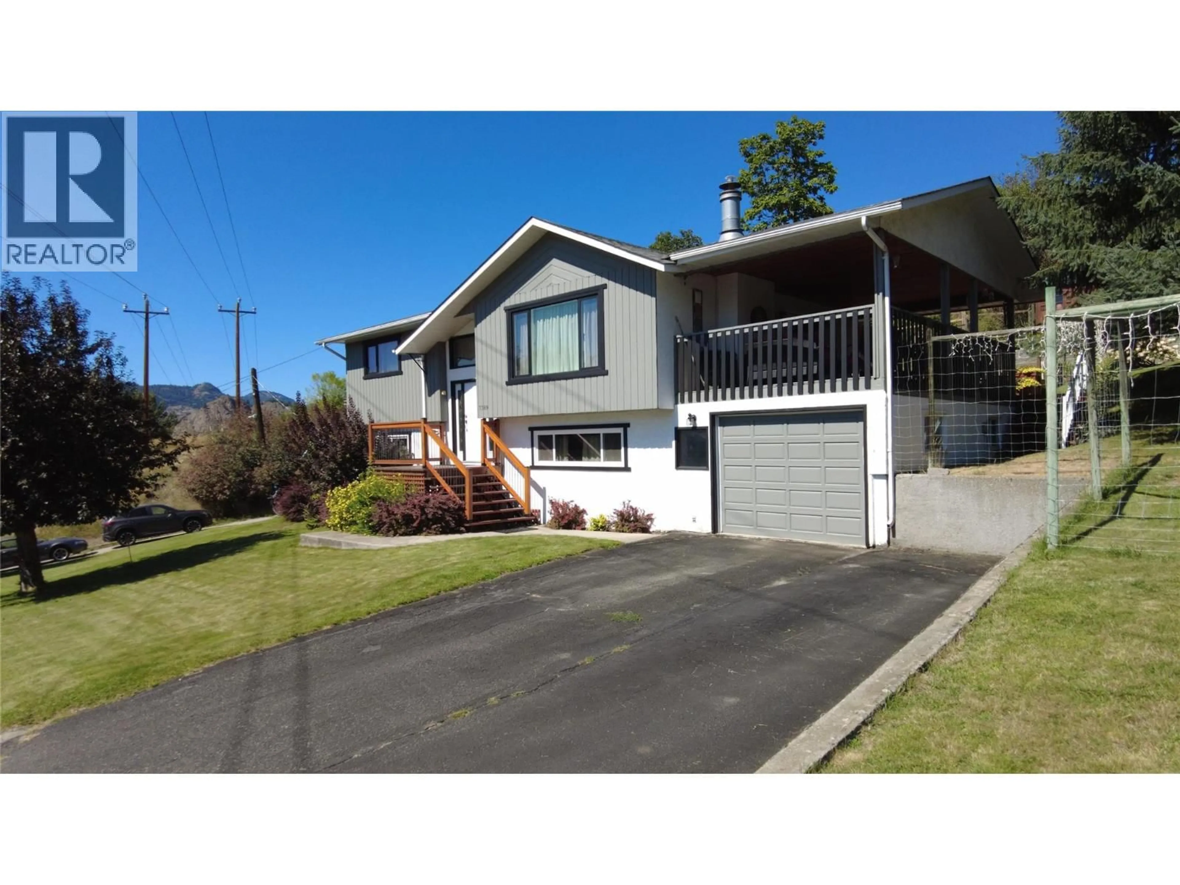 Home with vinyl exterior material, street for 7389 VALLEY HEIGHTS DRIVE, Grand Forks British Columbia V0H1H0