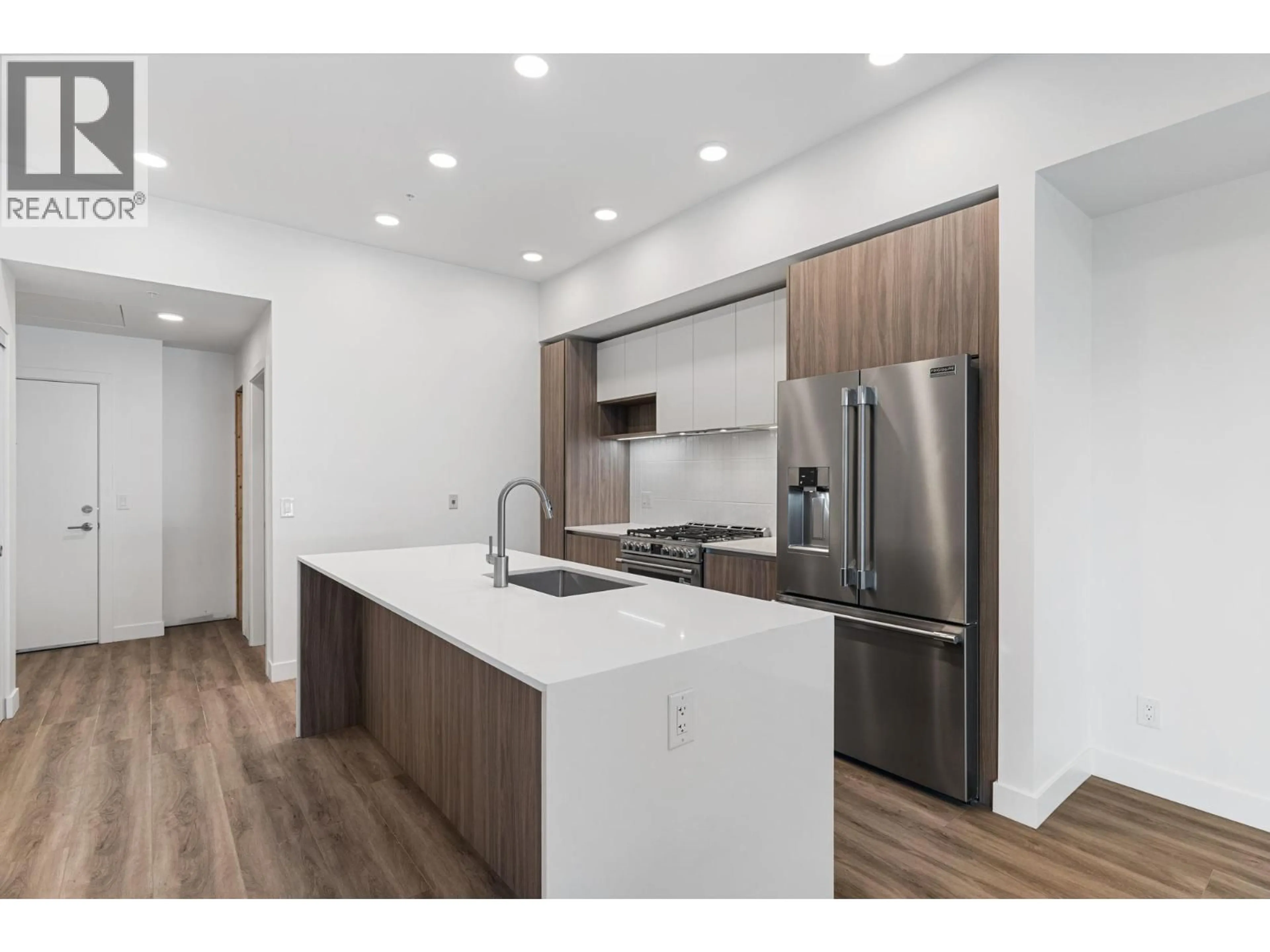 Open concept kitchen, wood/laminate floor for 110 - 2760 OLALLA ROAD, West Kelowna British Columbia V1Z2A9