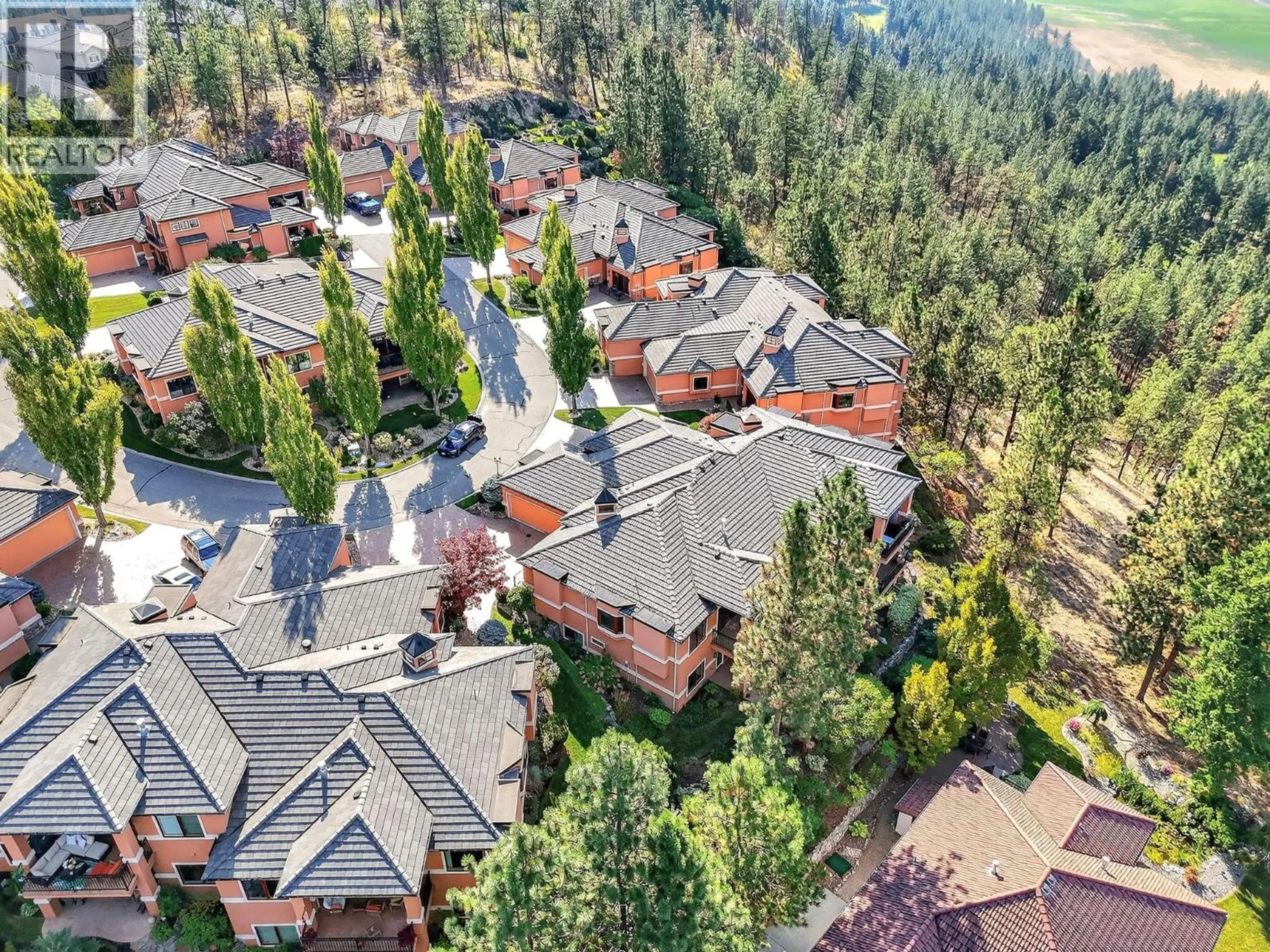 A pic from outside/outdoor area/front of a property/back of a property/a pic from drone, mountain view for 111 - 1910 CAPISTRANO DRIVE, Kelowna British Columbia V1V2S5