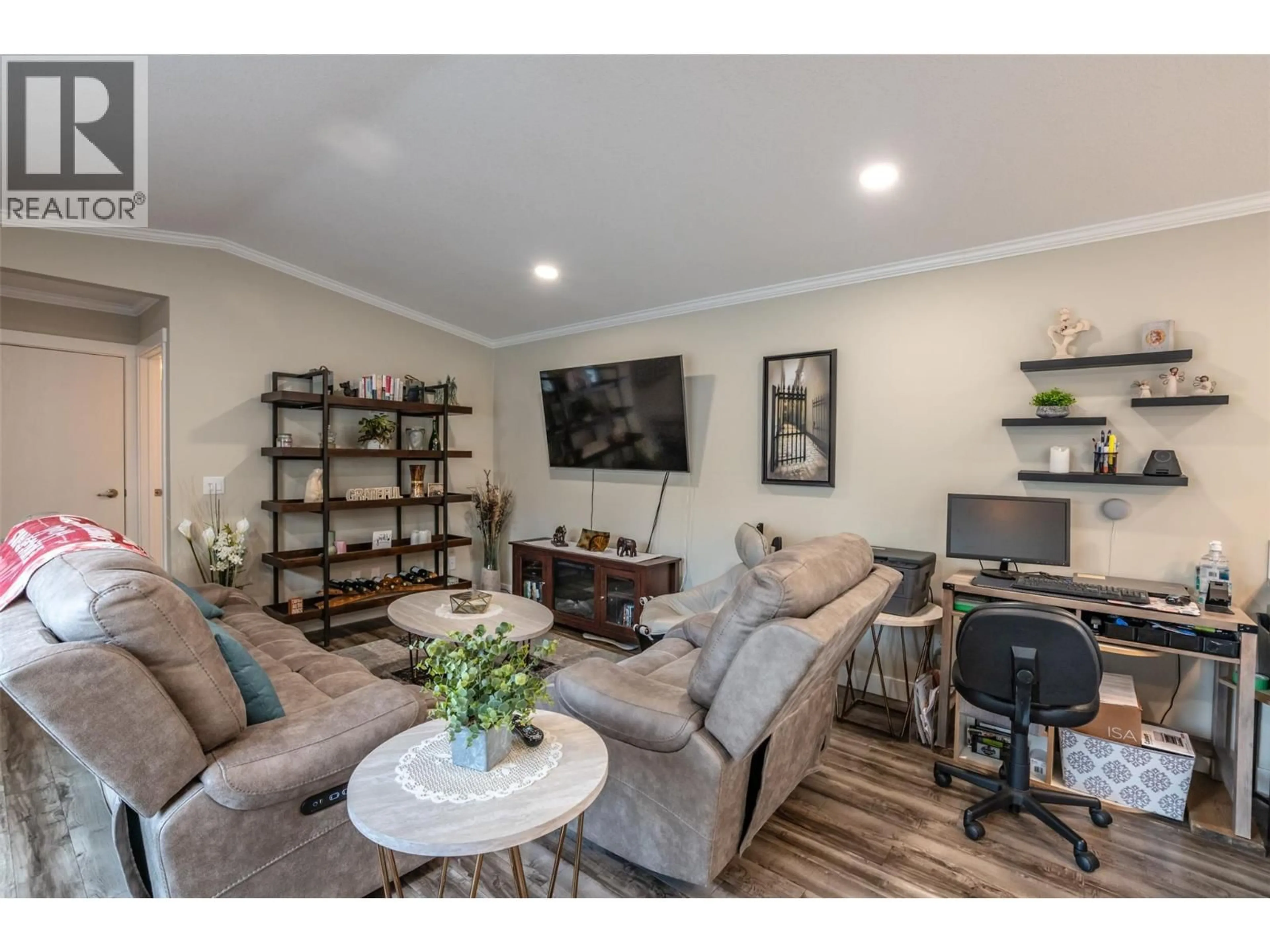 Living room with furniture, wood/laminate floor for 102 - 8598 HWY 97 OTHER, Oliver British Columbia V0H1T2