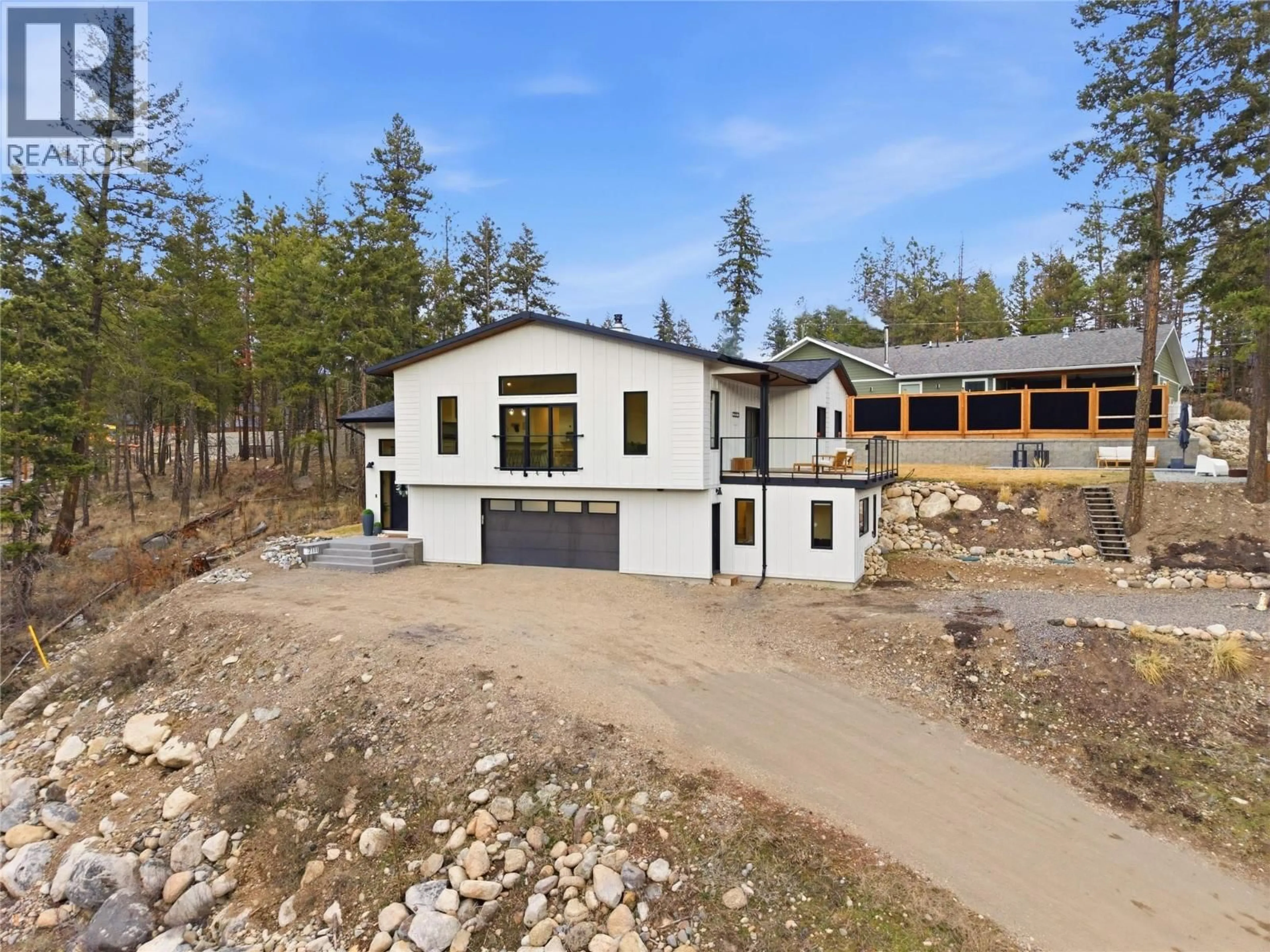 Home with vinyl exterior material, unknown for 7111 DUNWATERS ROAD, Kelowna British Columbia V1Z3W6