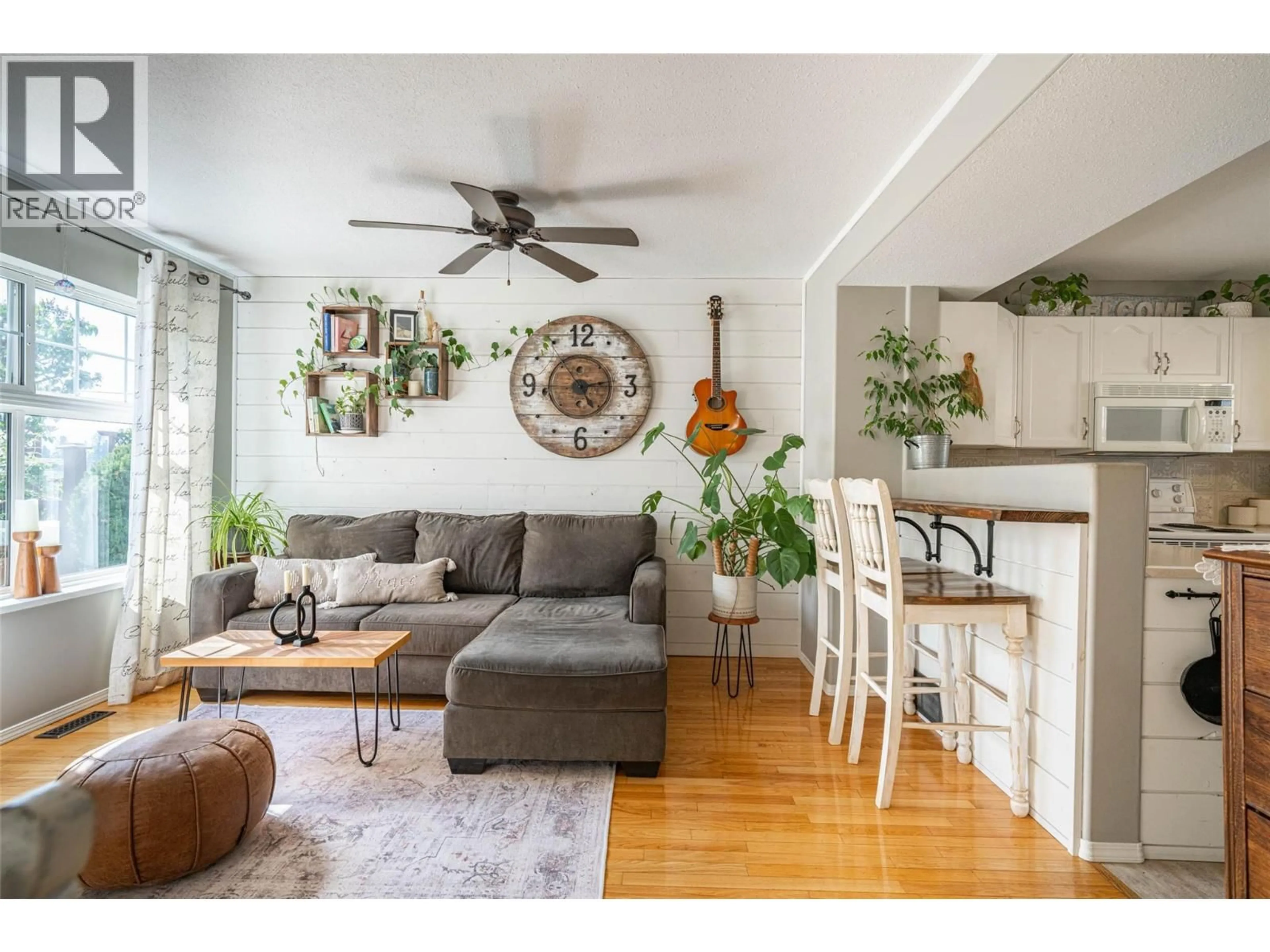 Living room with furniture, wood/laminate floor for 31 - 2395 PLEASANT VALLEY ROAD, Armstrong British Columbia V0E1B2