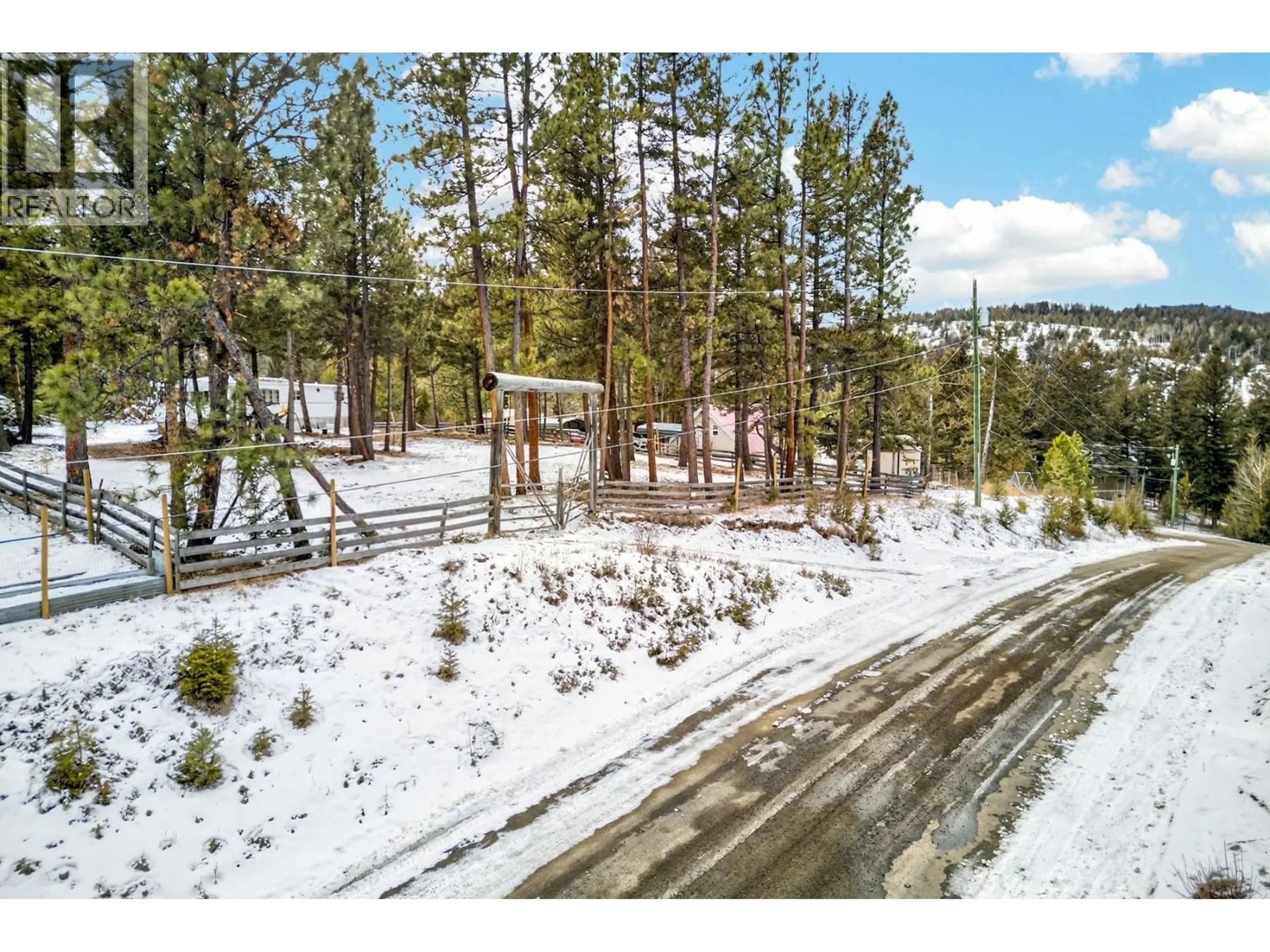 A pic from outside/outdoor area/front of a property/back of a property/a pic from drone, forest/trees view for 589 WILD ROSE DRIVE, Merritt British Columbia V1K1B8