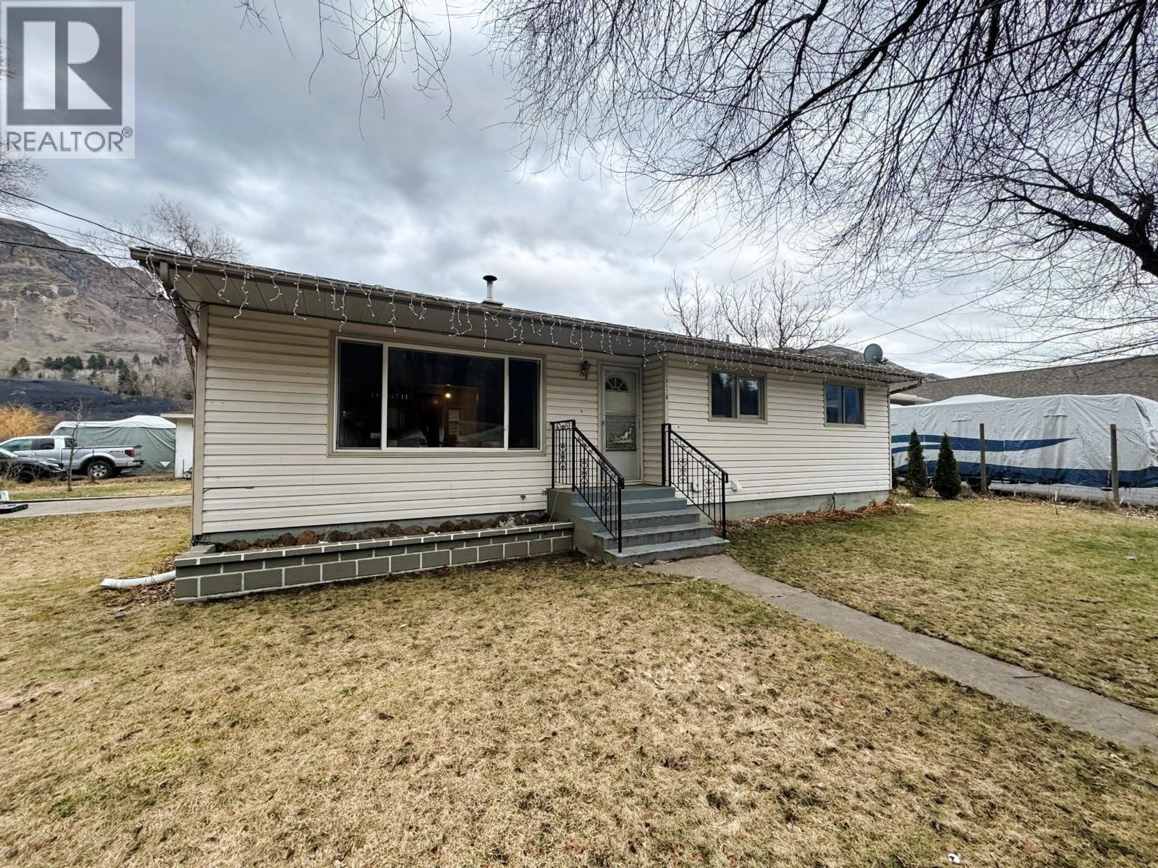 A pic from outside/outdoor area/front of a property/back of a property/a pic from drone, street for 8176 RIVERSIDE DRIVE, Grand Forks British Columbia V0H1H0