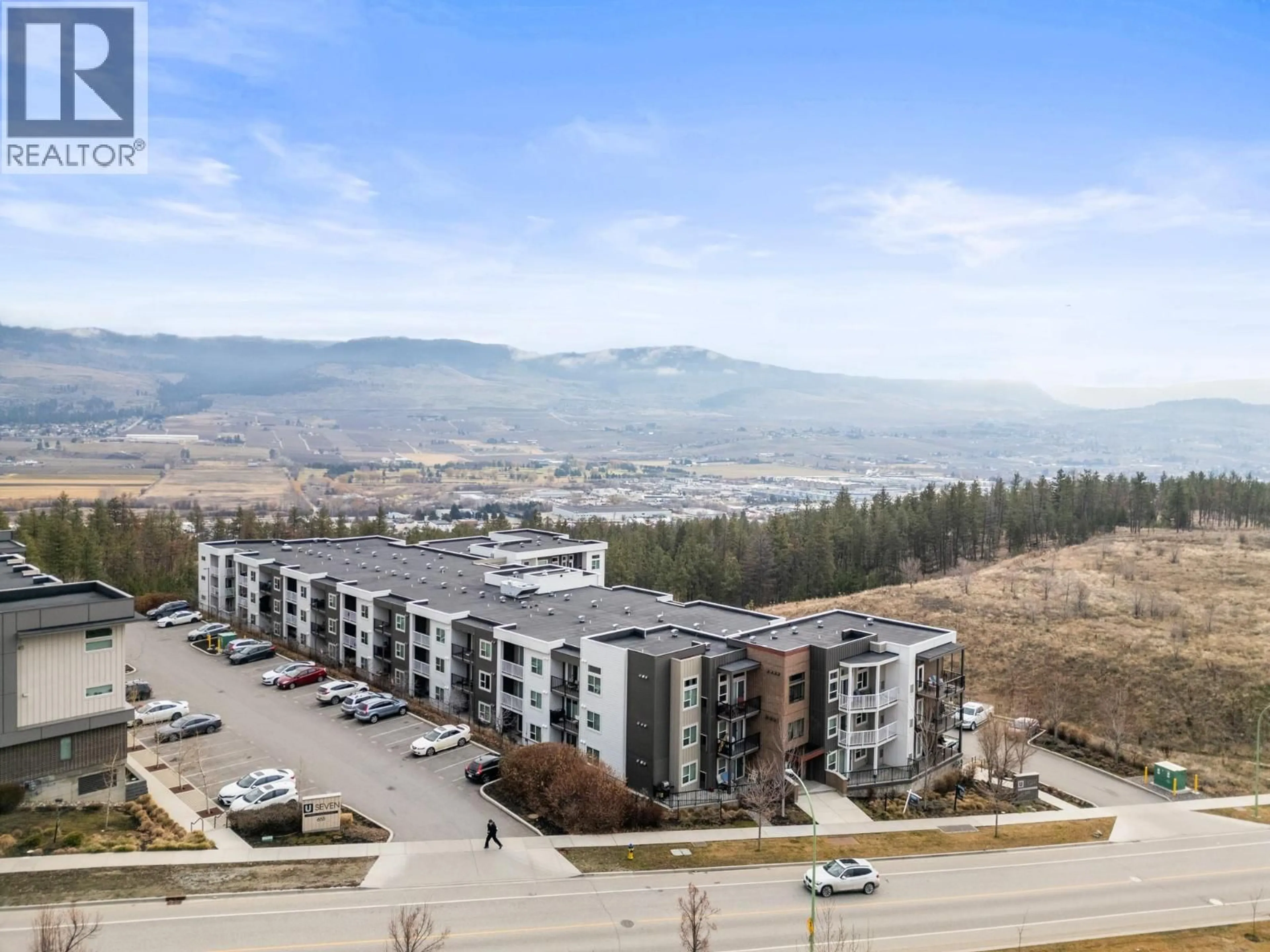 A pic from outside/outdoor area/front of a property/back of a property/a pic from drone, mountain view for PH25 - 625 ACADEMY WAY, Kelowna British Columbia V1V0E3