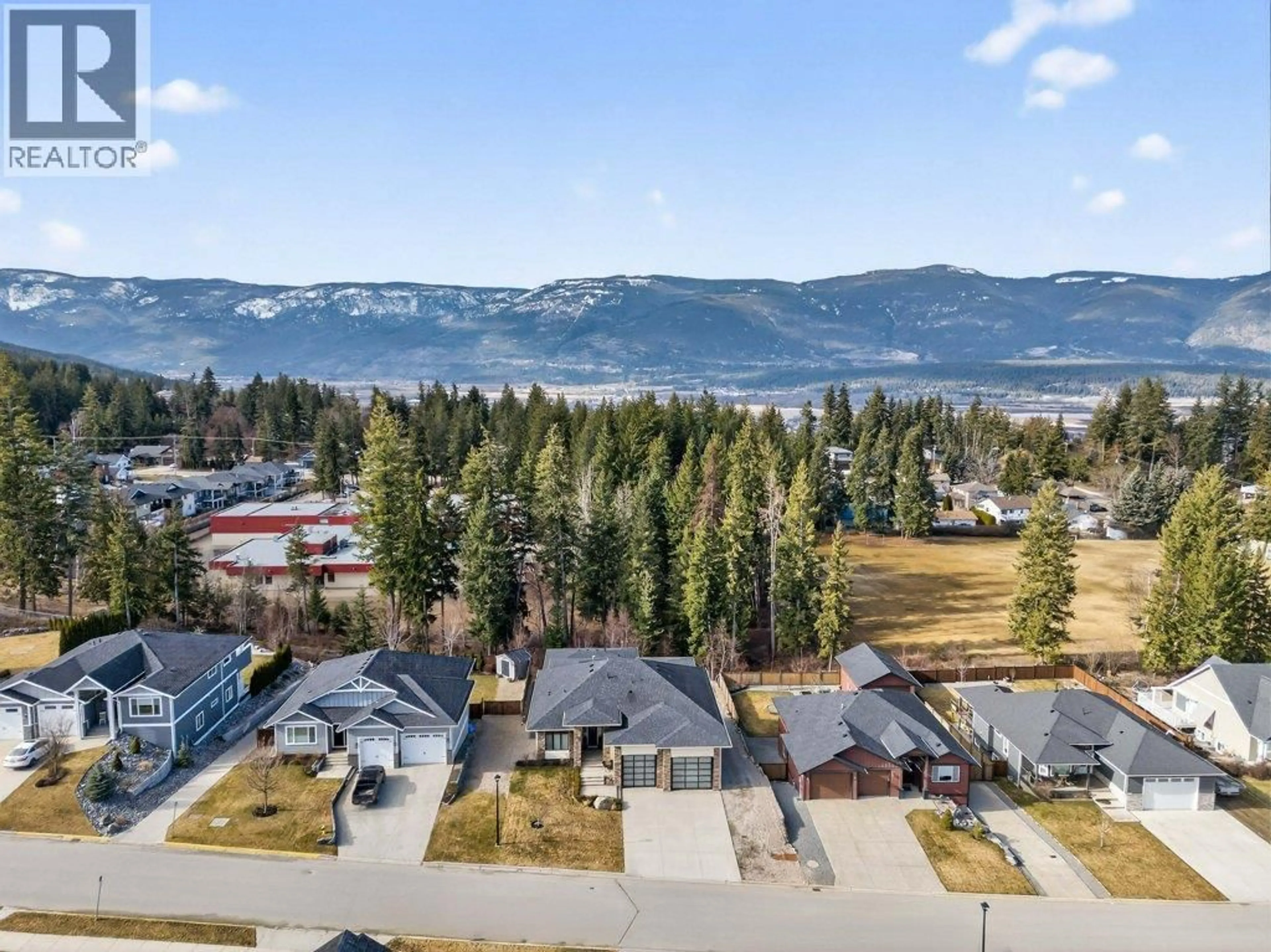 A pic from outside/outdoor area/front of a property/back of a property/a pic from drone, mountain view for 1221 23 STREET SOUTHEAST, Salmon Arm British Columbia V1E0C7