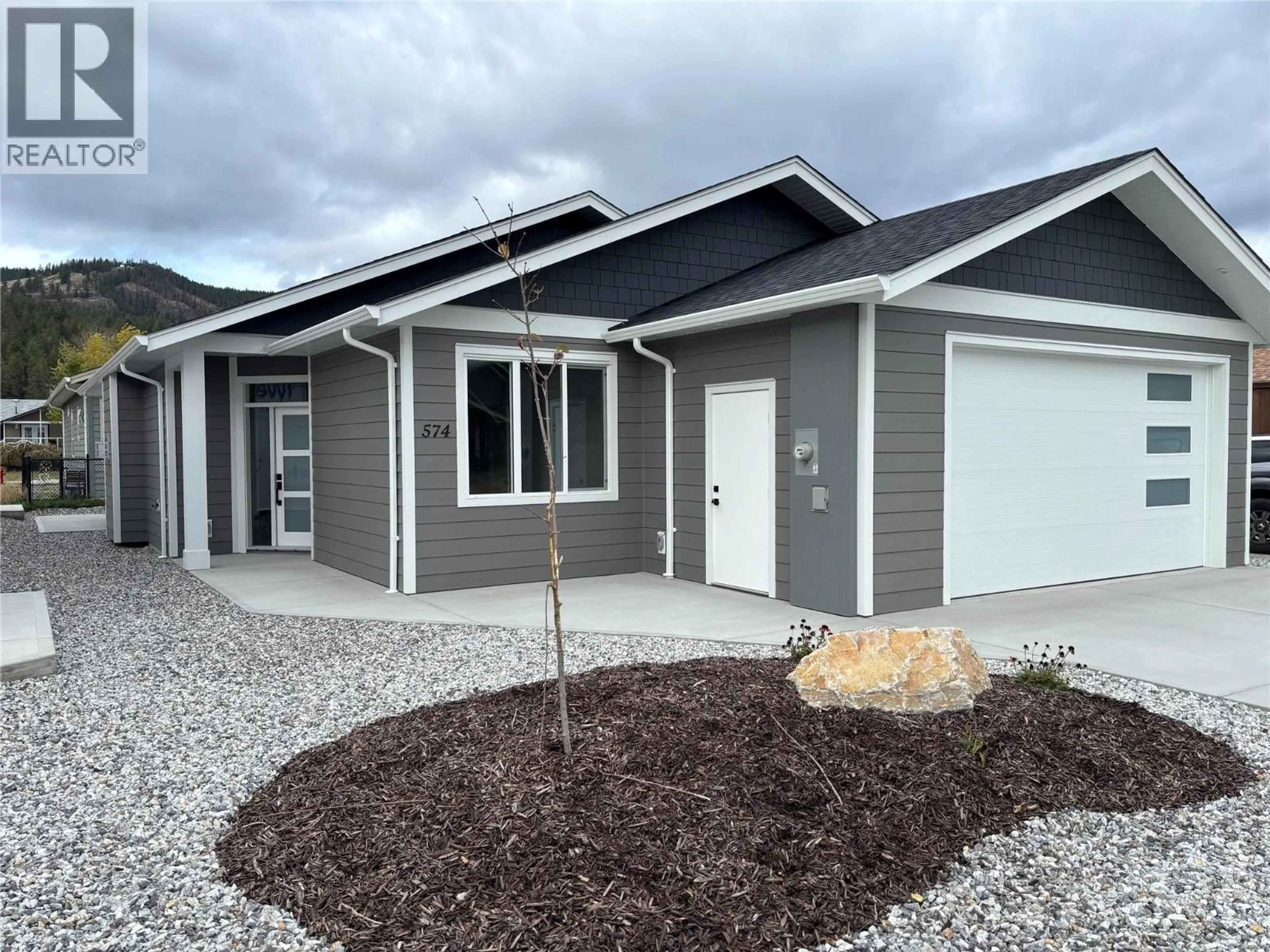 Home with vinyl exterior material, street for 574 MEADOWLARK AVENUE, Vernon British Columbia V1H2A1