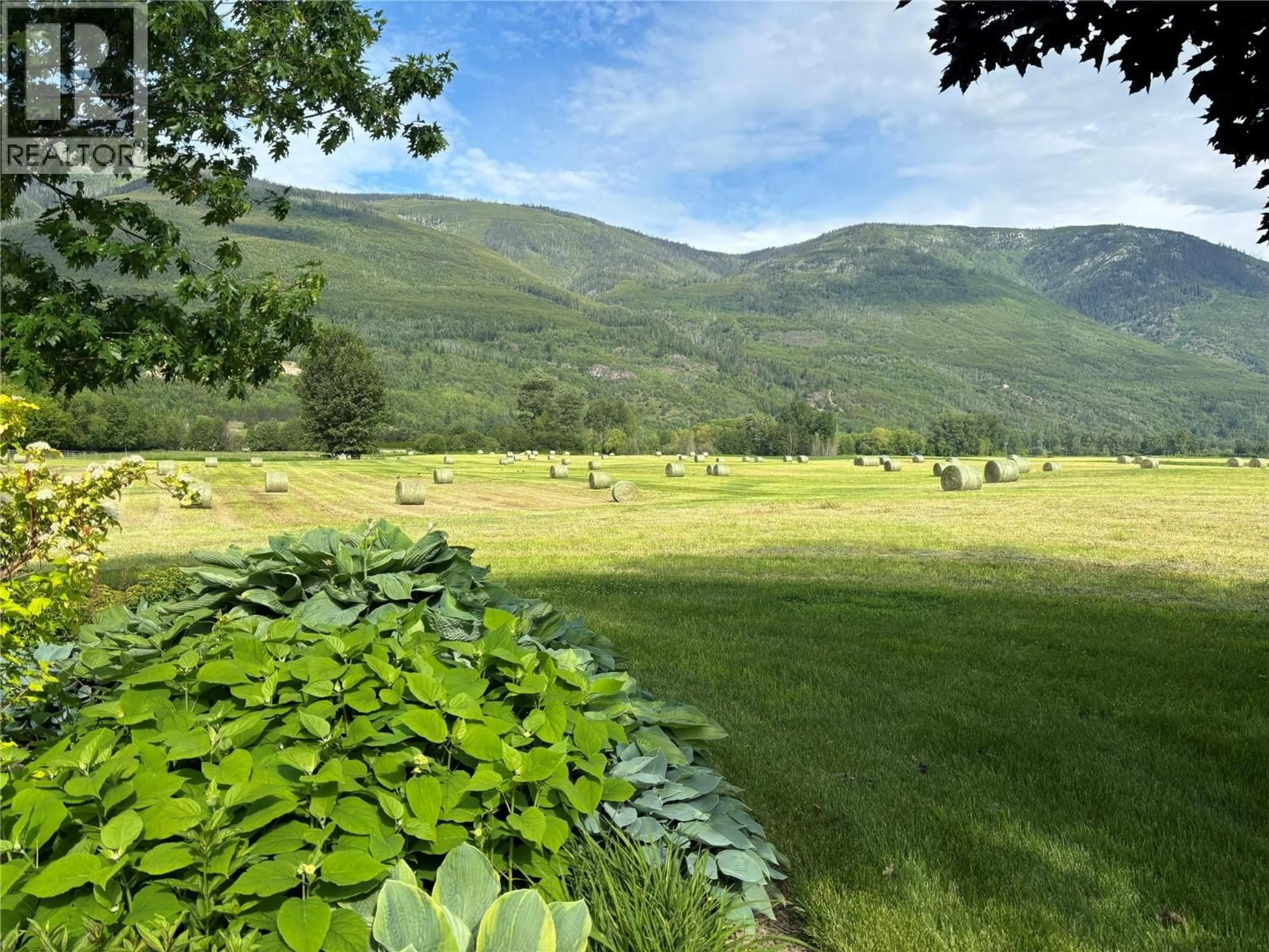 A pic from outside/outdoor area/front of a property/back of a property/a pic from drone, mountain view for 152 SALMON RIVER ROAD, Salmon Arm British Columbia V1E3E3