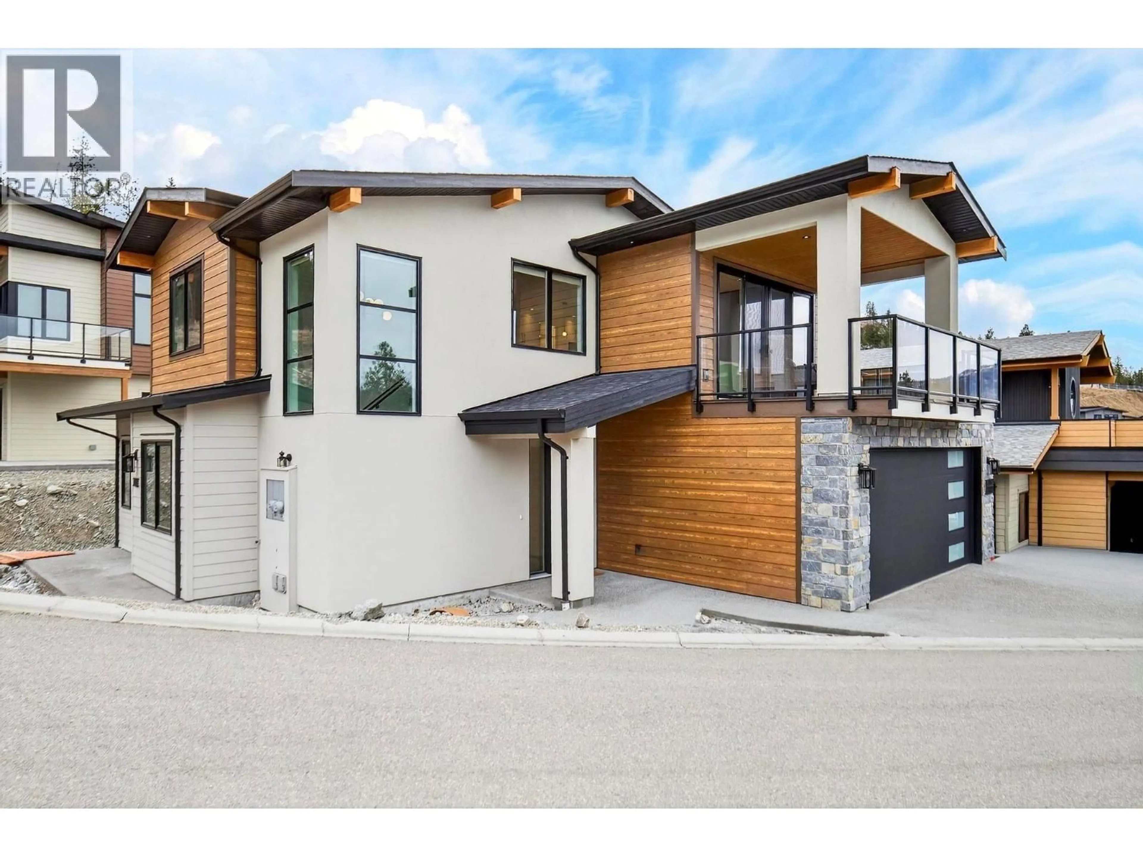 Home with brick exterior material, street for 10-1960 NORTHERN FLICKER COURT, Kelowna British Columbia V1V0G3