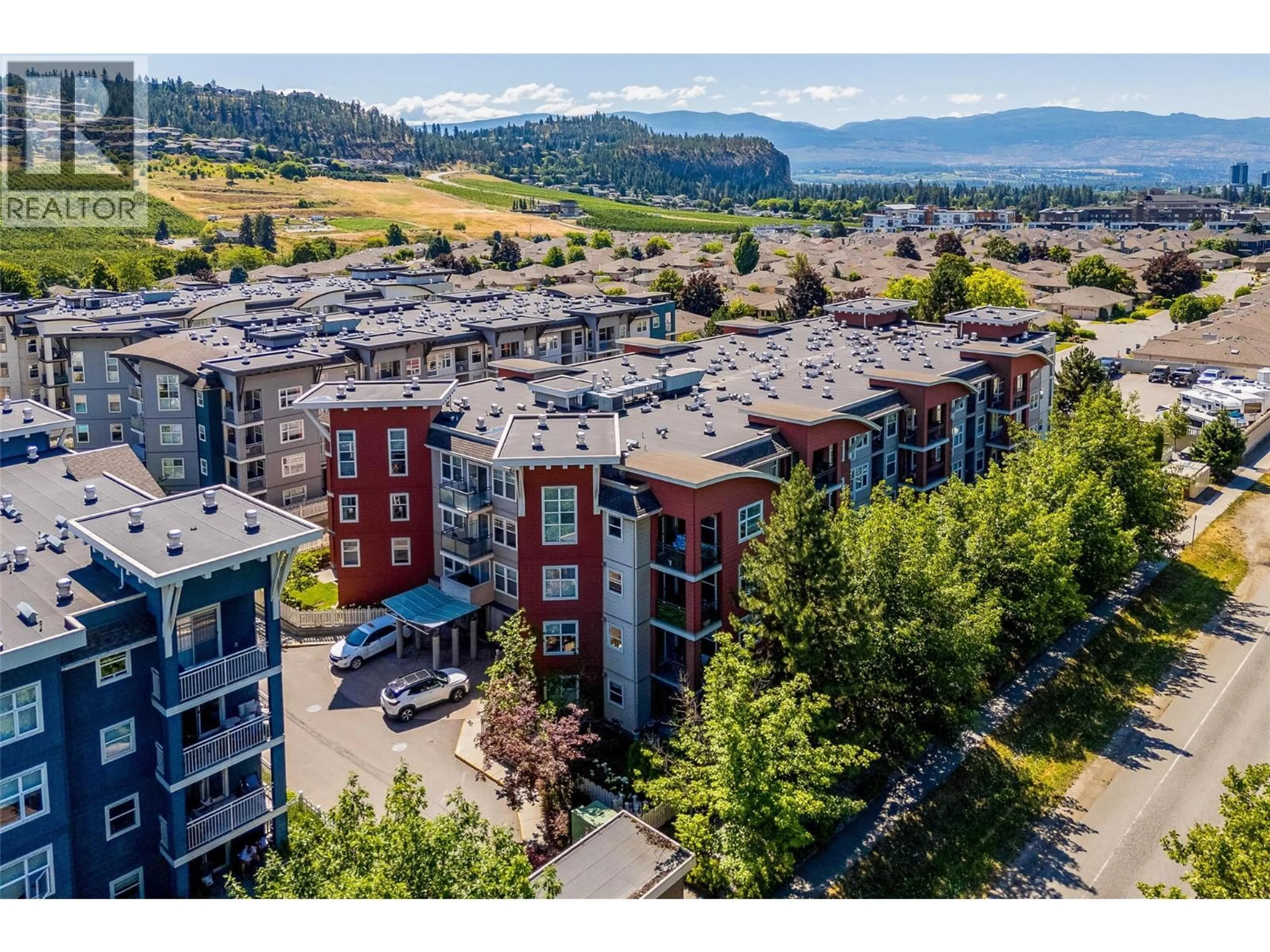 A pic from outside/outdoor area/front of a property/back of a property/a pic from drone, mountain view for 410 - 555 YATES ROAD, Kelowna British Columbia V1V2V2