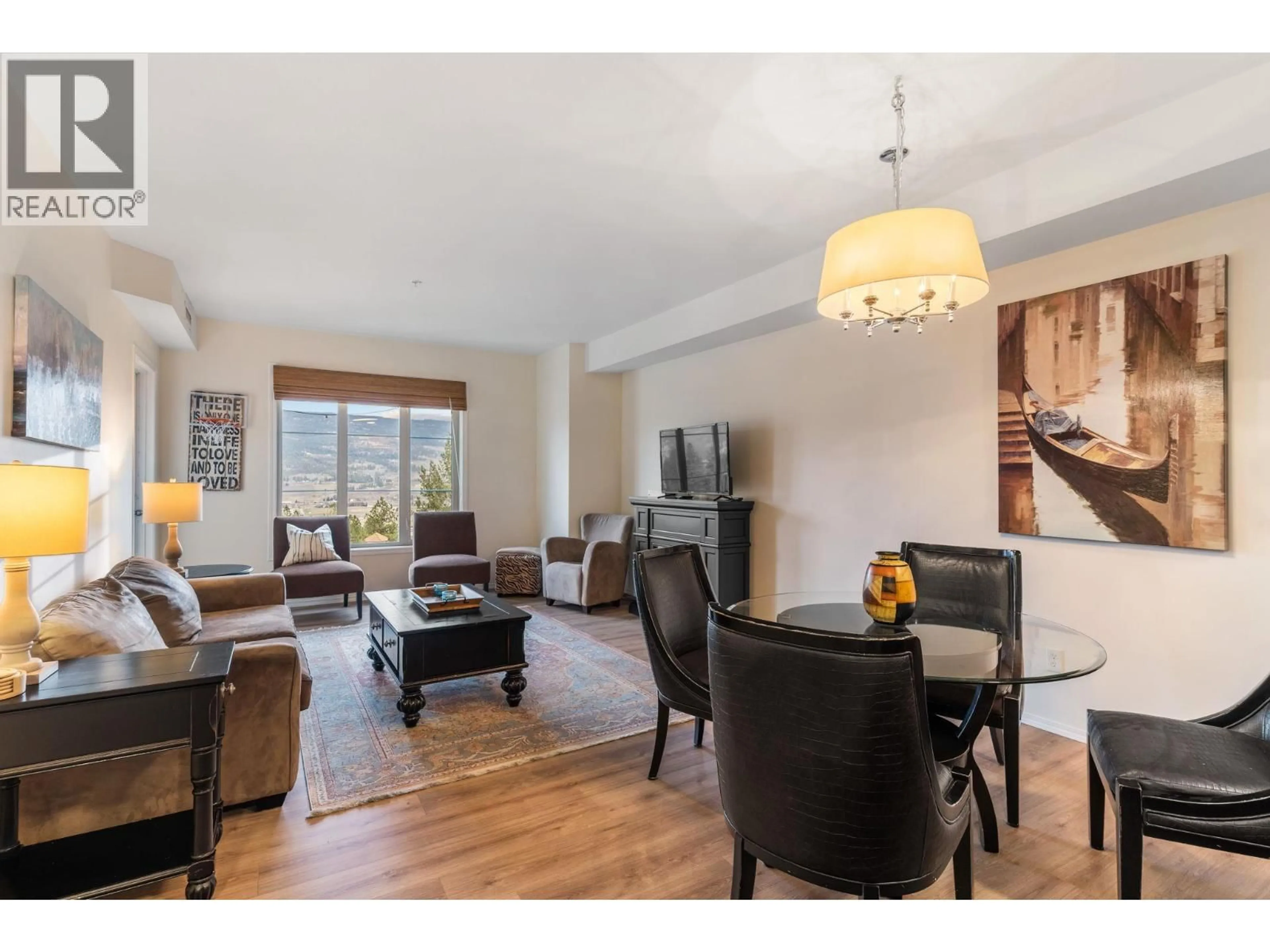 Living room with furniture, wood/laminate floor for 1616 - 1875 COUNTRY CLUB DRIVE, Kelowna British Columbia V1V2W7