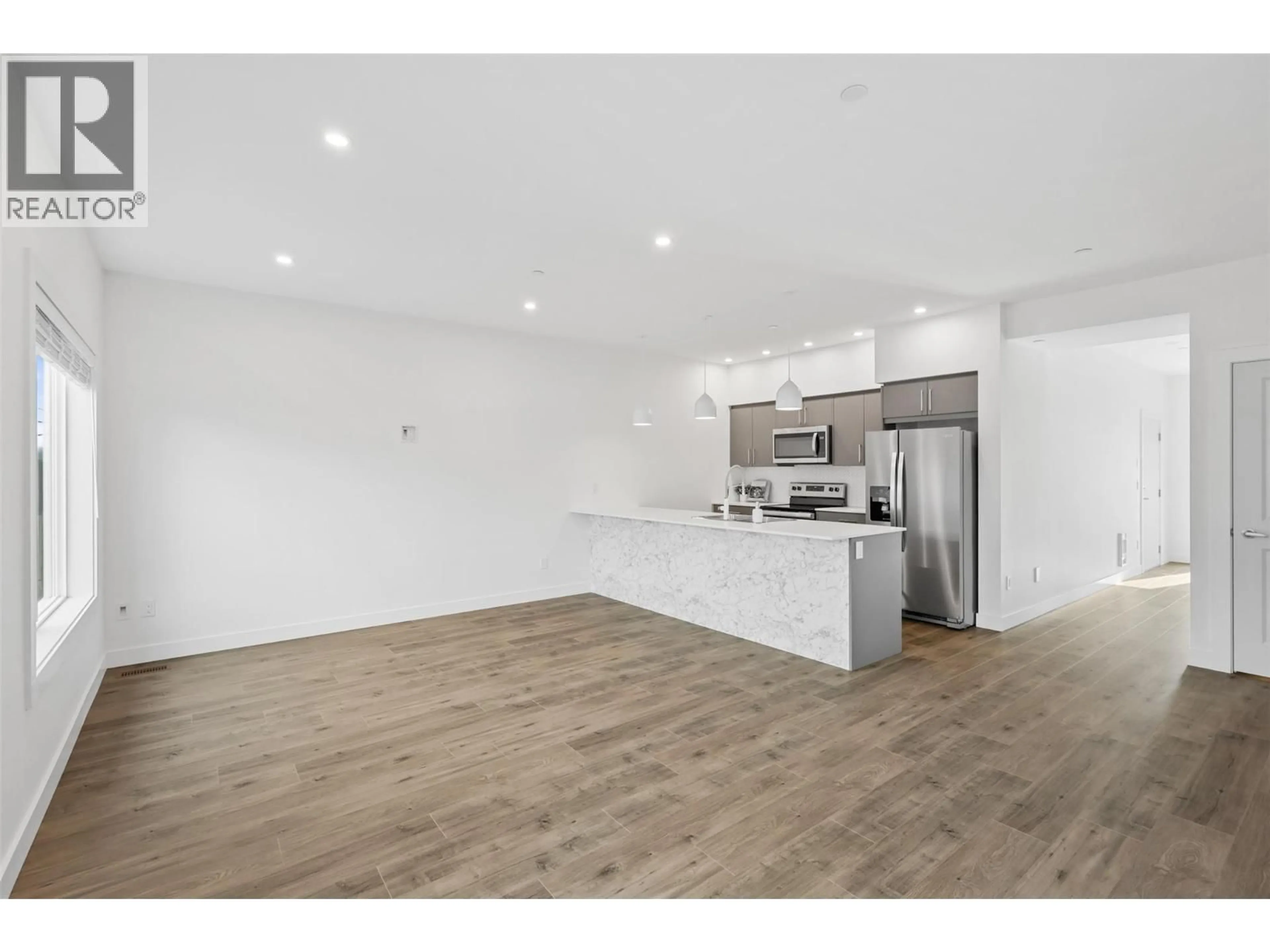 Open concept kitchen, wood/laminate floor for 117 - 8960 DALLAS DRIVE, Kamloops British Columbia V2C0K8