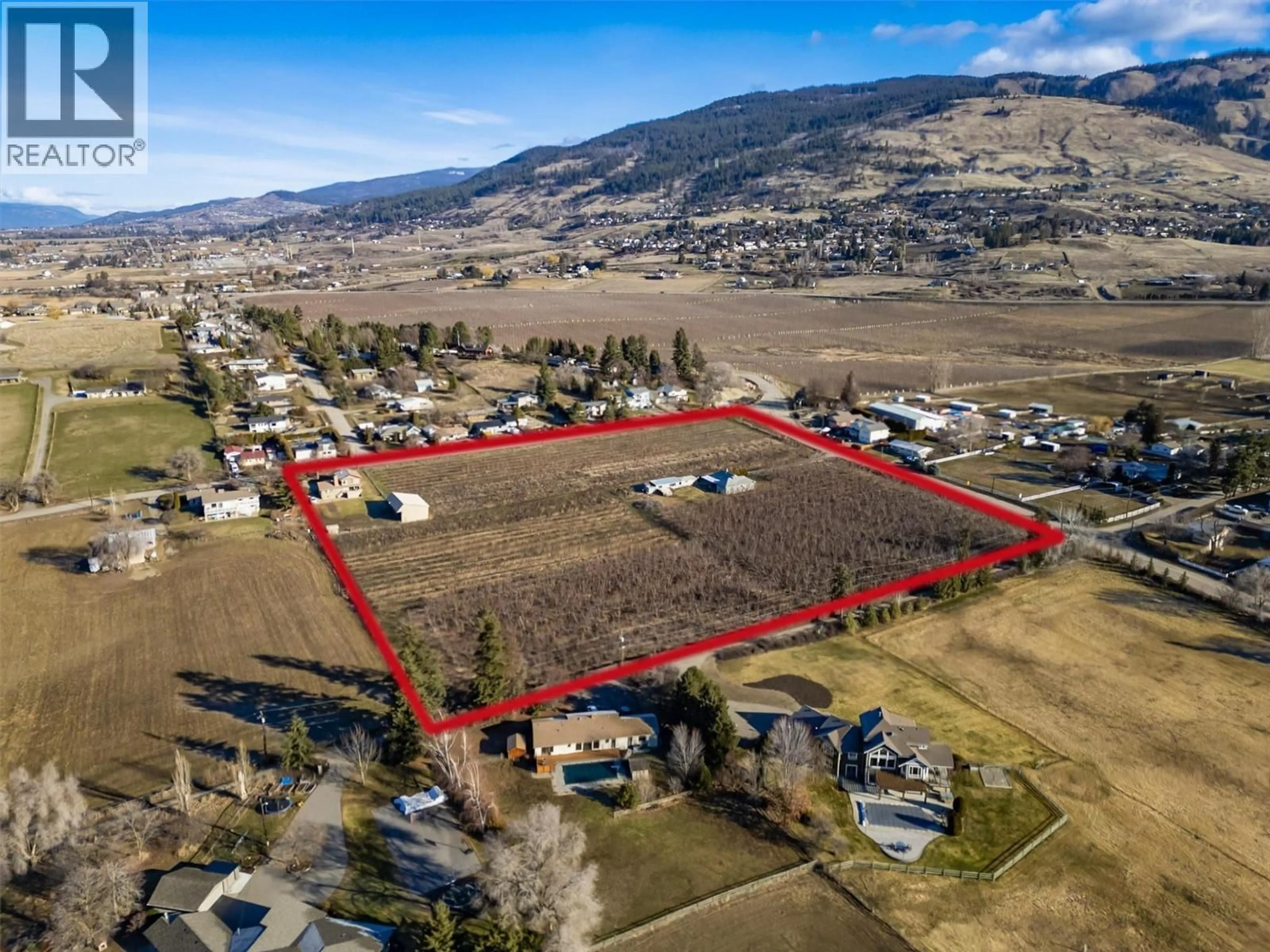 A pic from outside/outdoor area/front of a property/back of a property/a pic from drone, mountain view for 9810 VENABLES DRIVE, Coldstream British Columbia V1B2J9