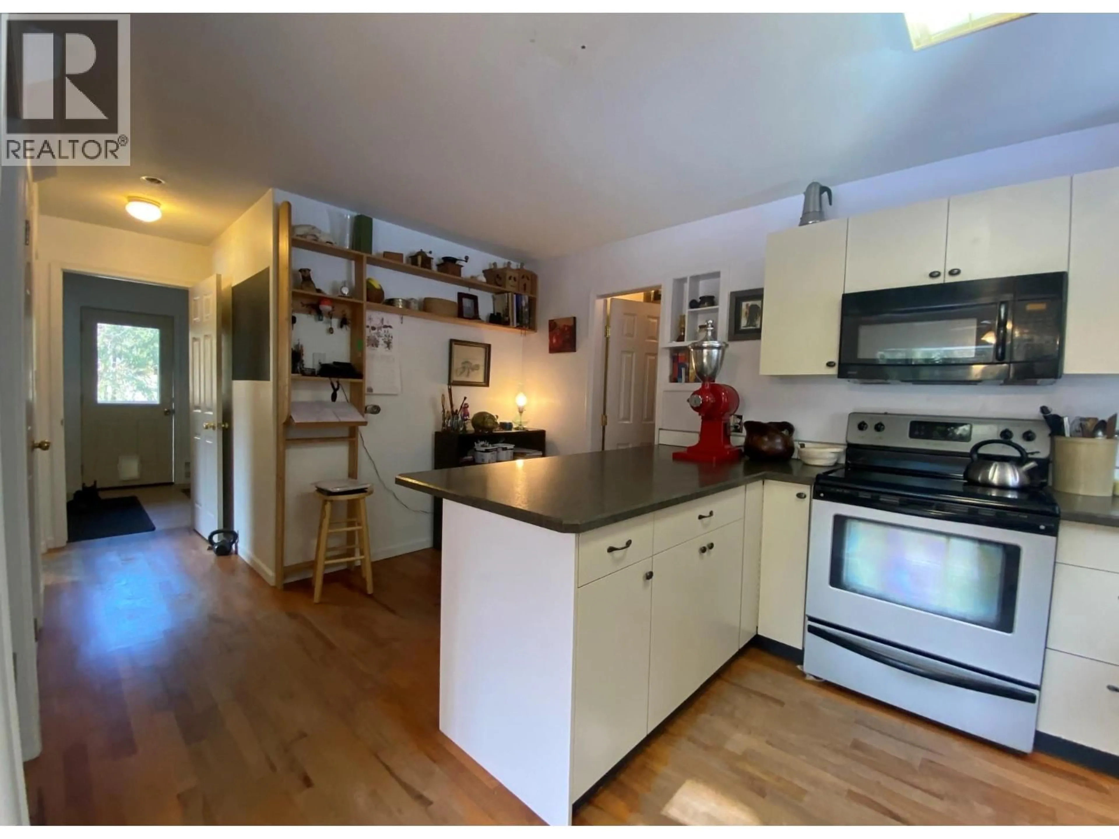 Open concept kitchen, wood/laminate floor for 10625 GRANBY ROAD, Grand Forks British Columbia V0H1H1