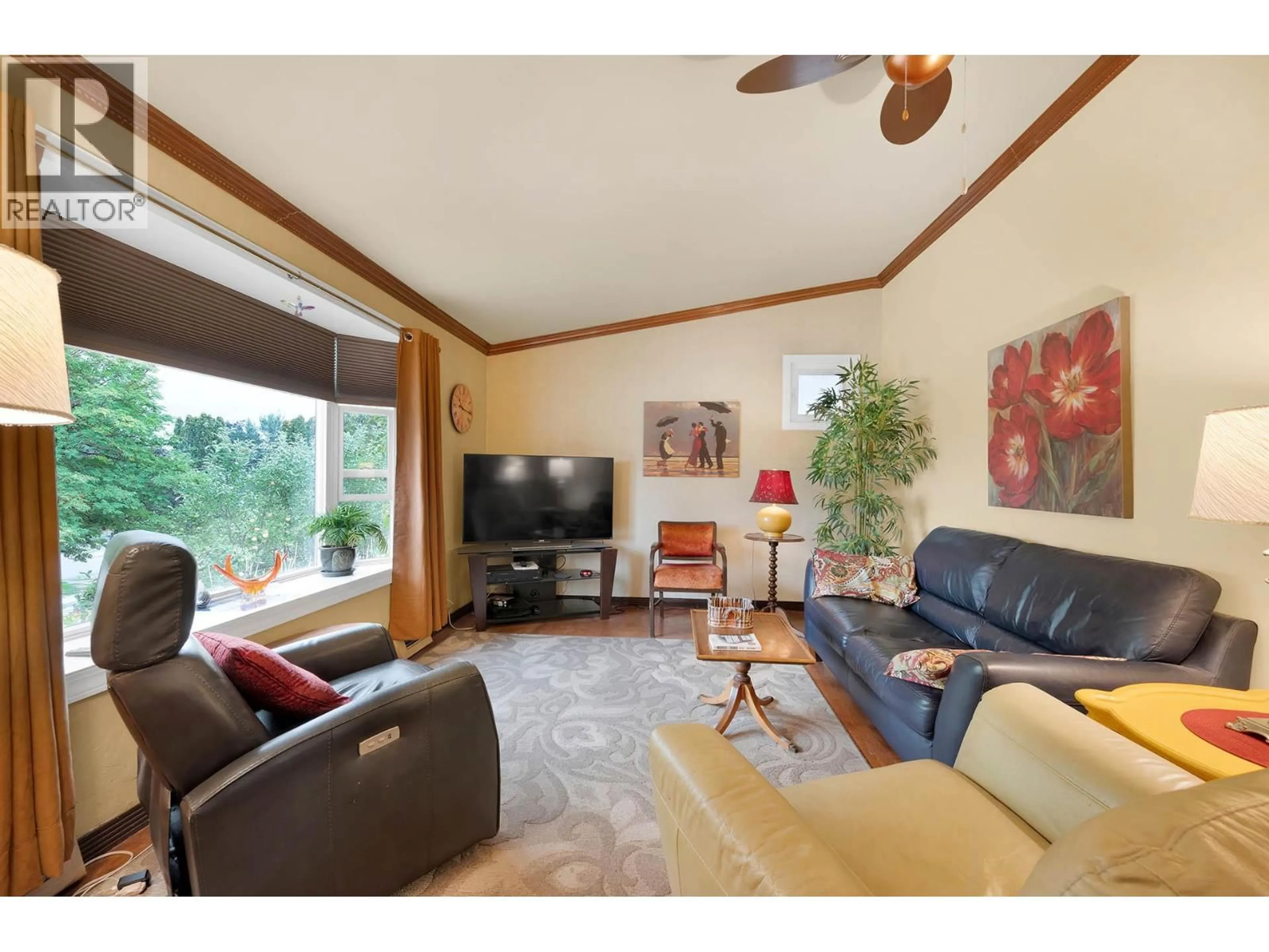 Living room with furniture, wood/laminate floor for 681 DOUGLAS STREET, Kamloops British Columbia V2C3C4