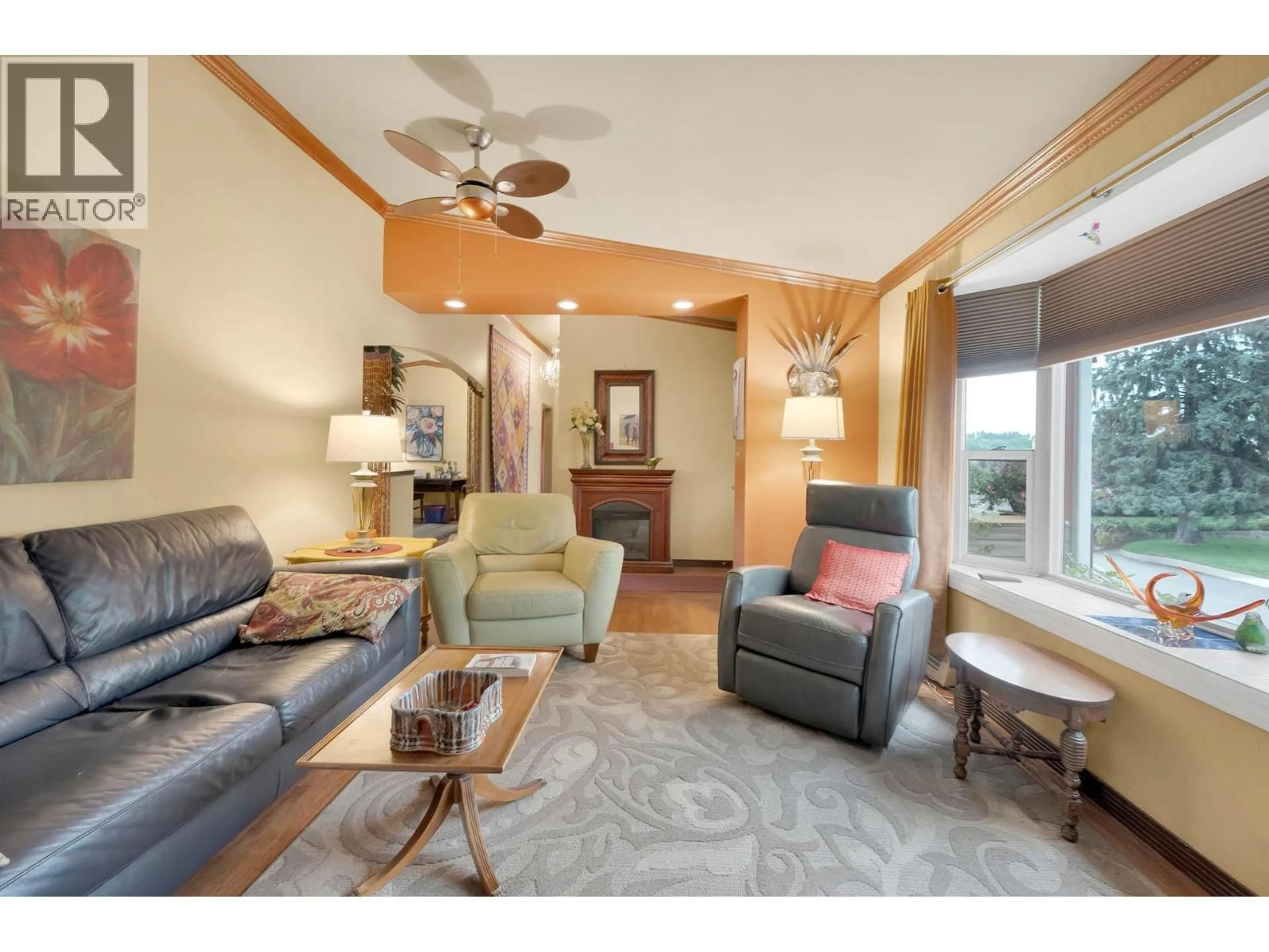 Living room with furniture, wood/laminate floor for 681 DOUGLAS STREET, Kamloops British Columbia V2C3C4