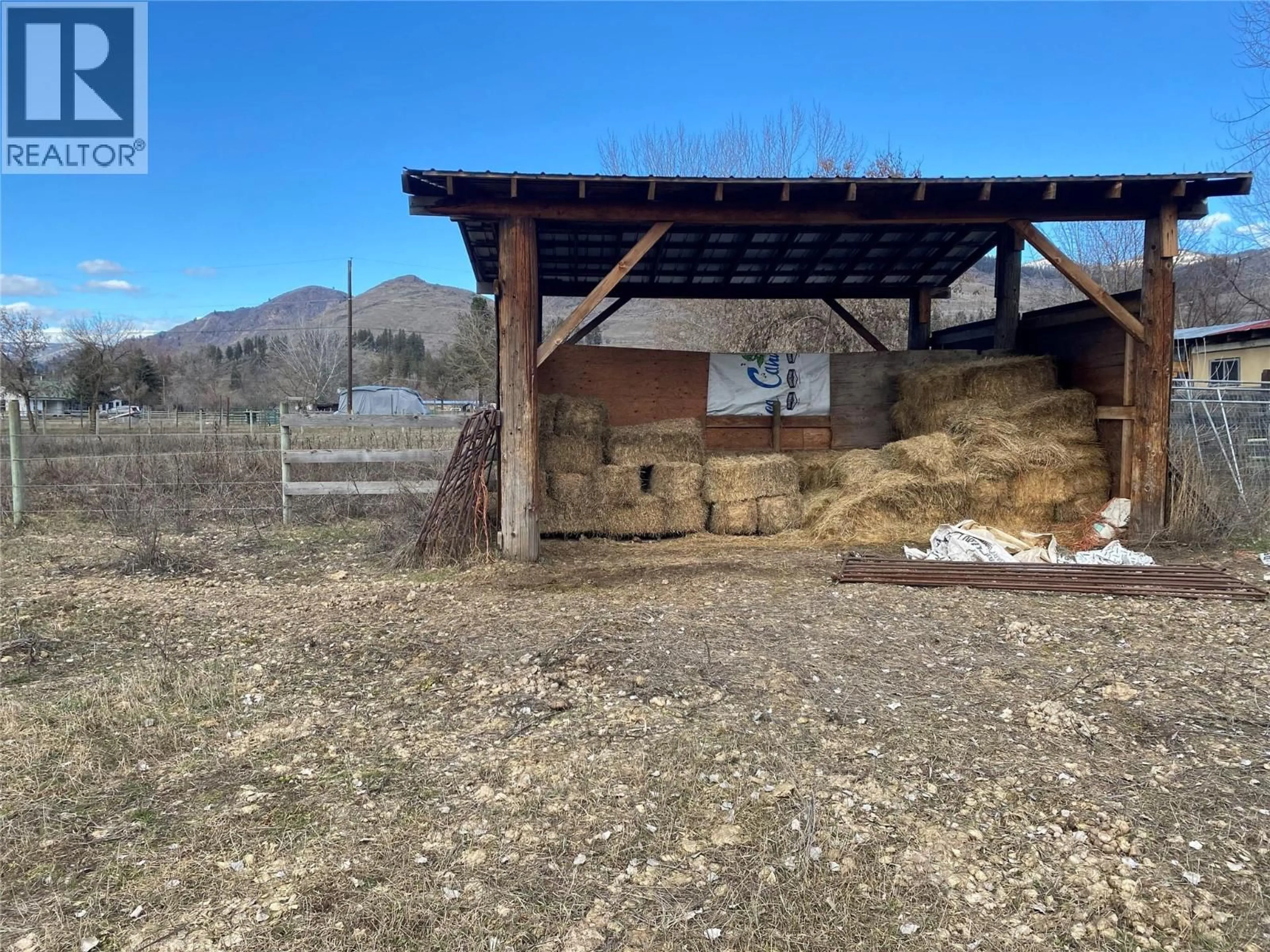 A pic from outside/outdoor area/front of a property/back of a property/a pic from drone, mountain view for 5945 DARCY ROAD, Grand Forks British Columbia V0H1H4