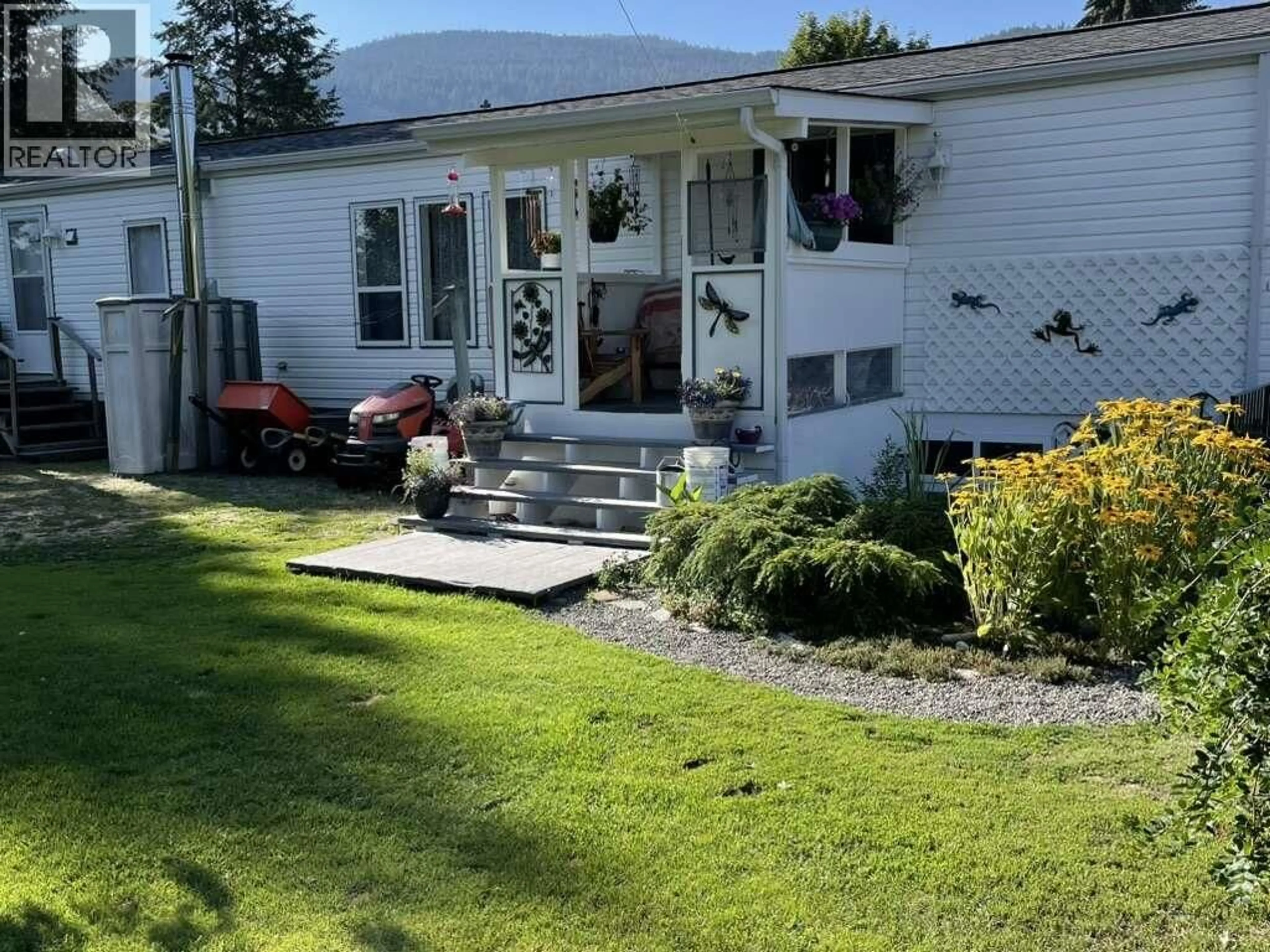 A pic from outside/outdoor area/front of a property/back of a property/a pic from drone, mountain view for 4980 VERNON STREET, Grand Forks British Columbia V0H1H5