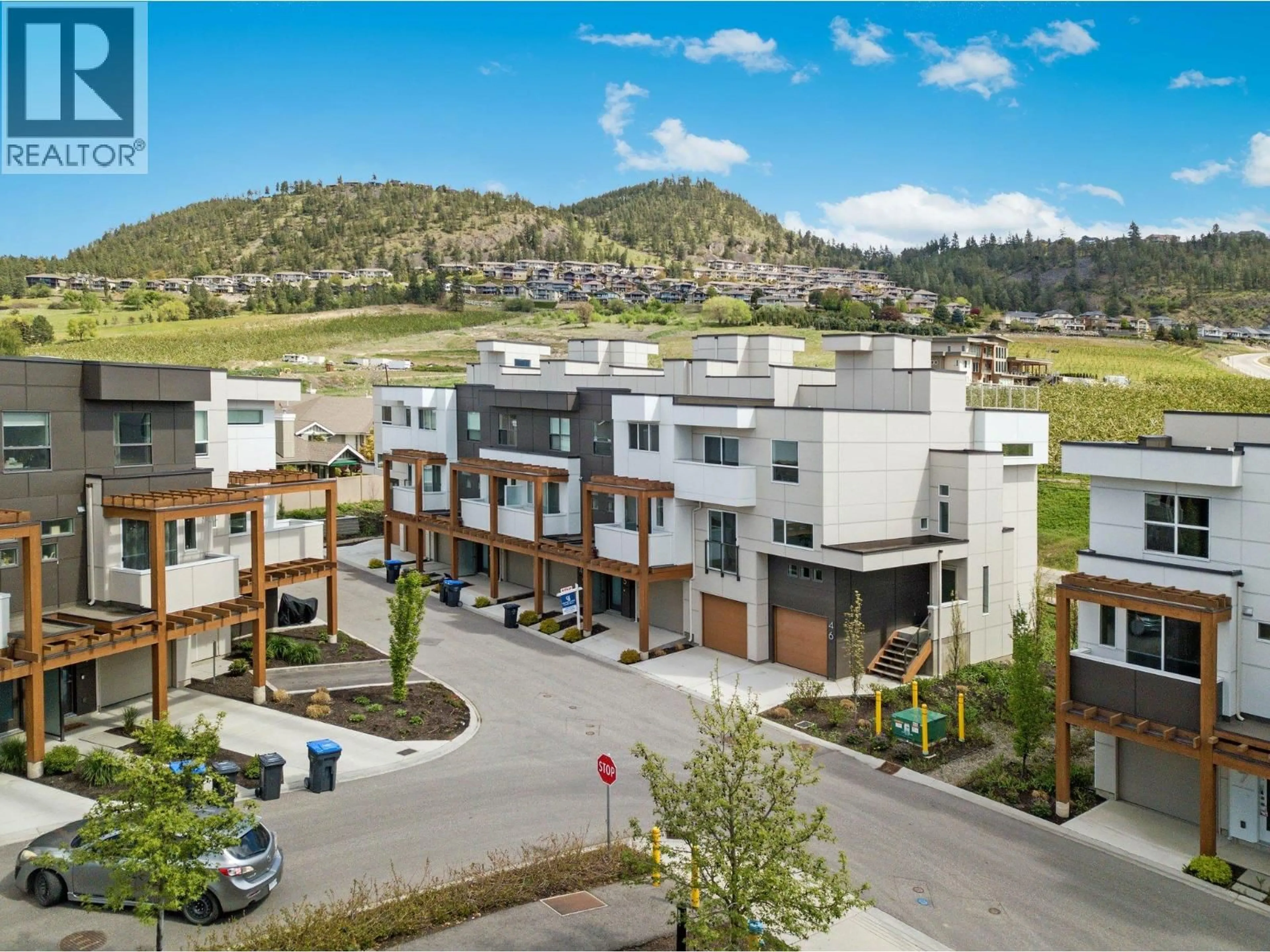 A pic from outside/outdoor area/front of a property/back of a property/a pic from drone, mountain view for 43 - 720 VALLEY ROAD, Kelowna British Columbia V1V0E1