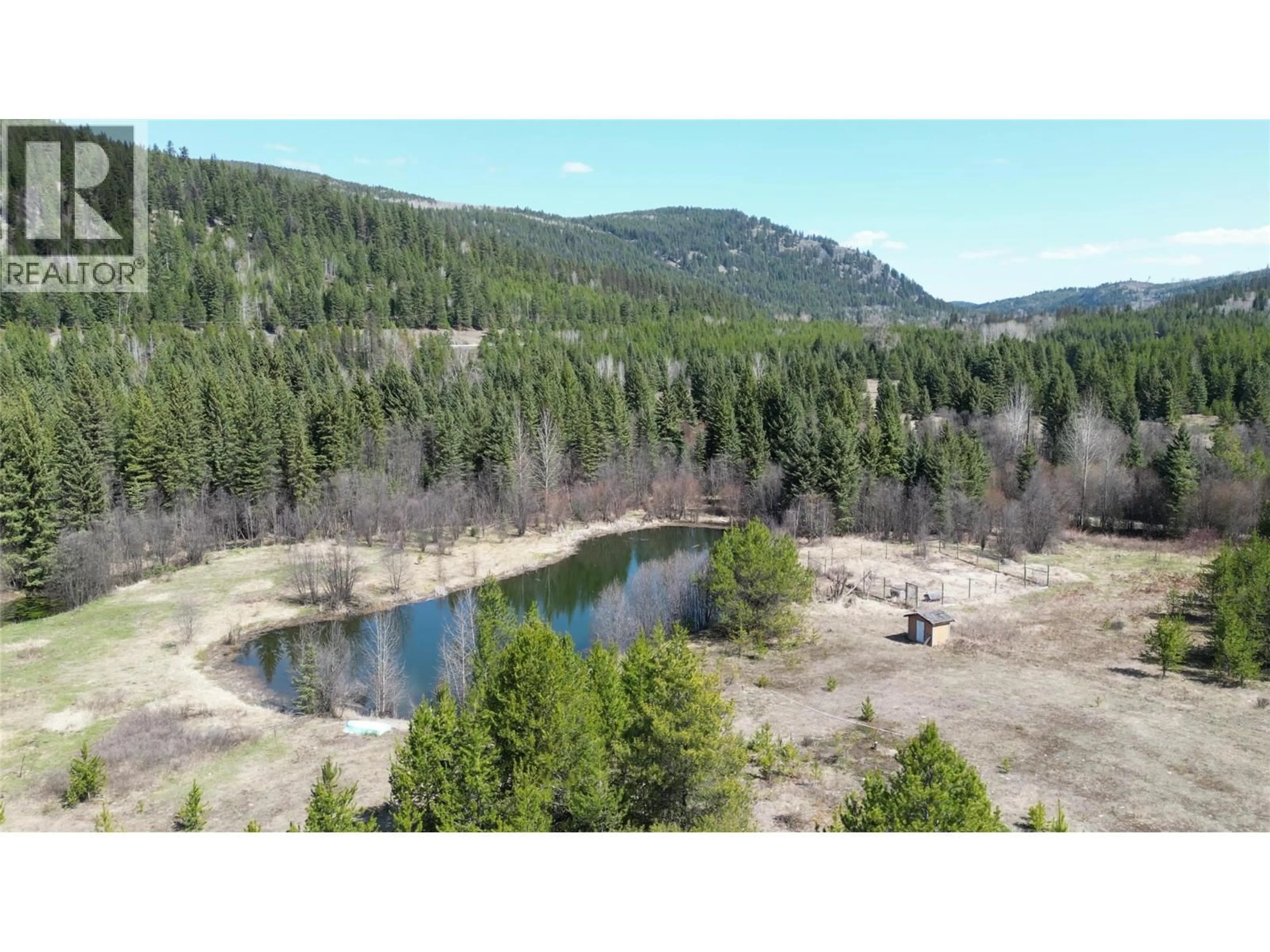 A pic from outside/outdoor area/front of a property/back of a property/a pic from drone, forest/trees view for 12165 HIGHWAY 3 HIGHWAY, Greenwood British Columbia V0H1J0