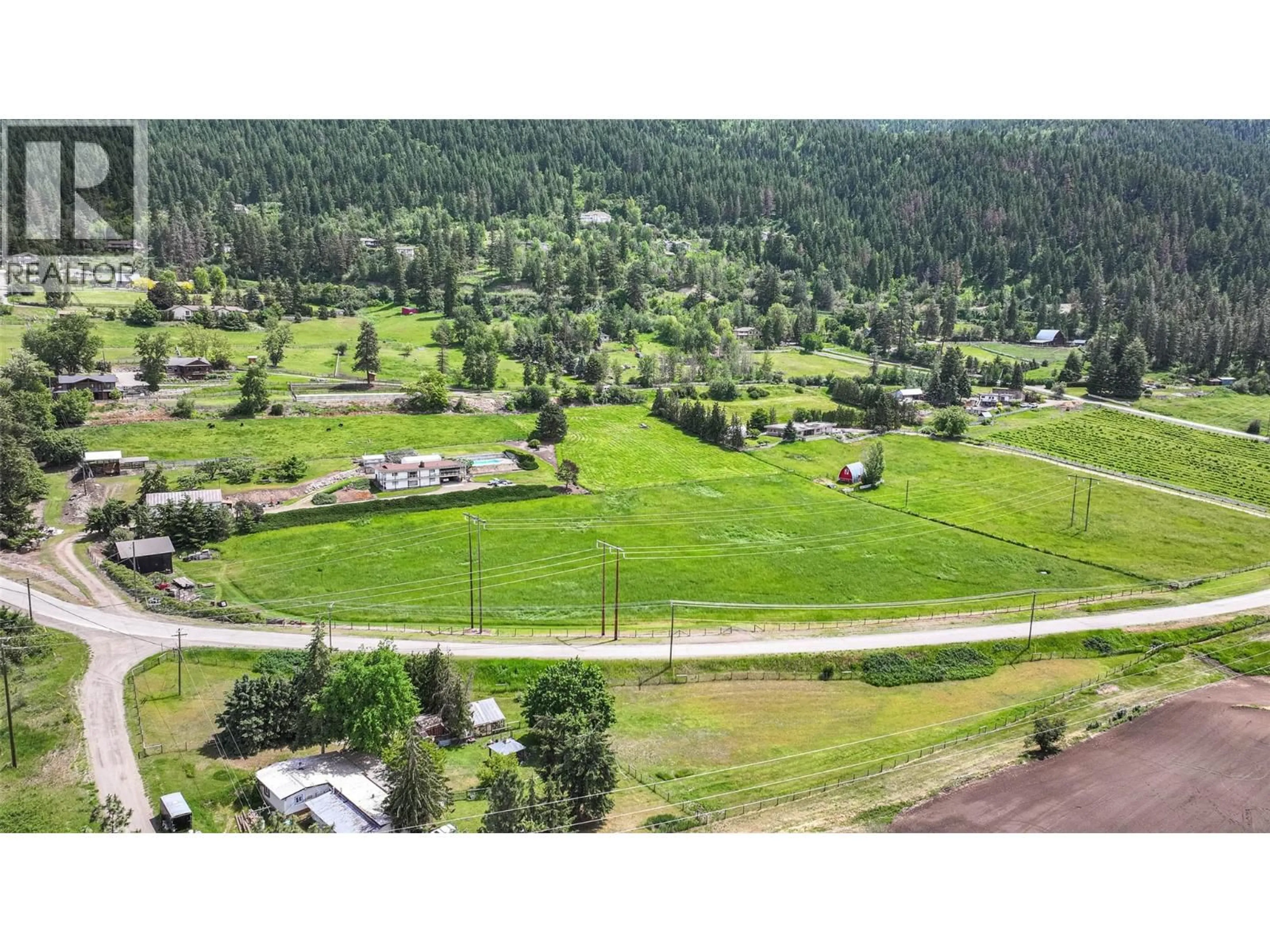 A pic from outside/outdoor area/front of a property/back of a property/a pic from drone, mountain view for 5541 DIXON DAM ROAD, Vernon British Columbia V1B3J7