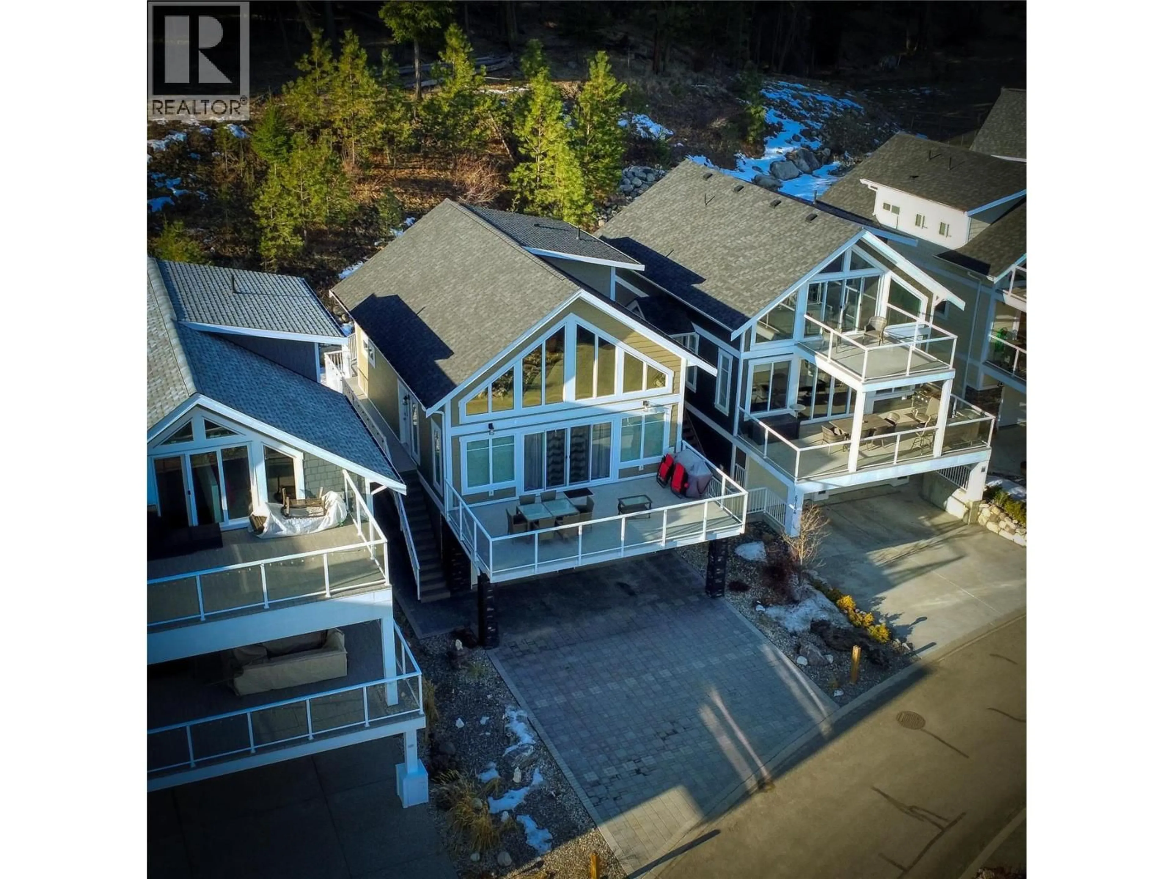 A pic from outside/outdoor area/front of a property/back of a property/a pic from drone, street for 302 - 6742 MARBELLA LOOP, Kelowna British Columbia V1Z3R8