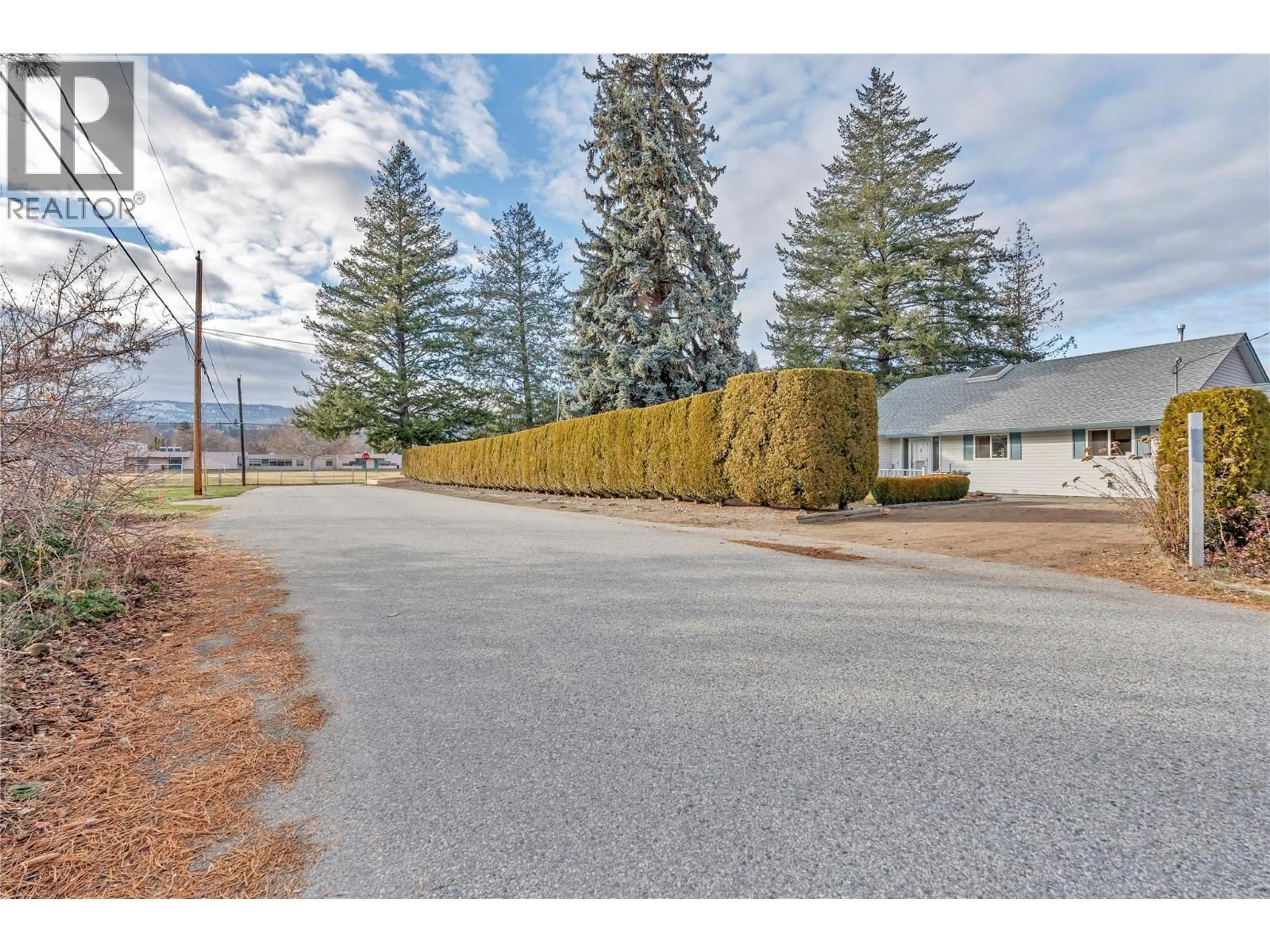 A pic from outside/outdoor area/front of a property/back of a property/a pic from drone, unknown for 706 MILLER STREET, Summerland British Columbia V0H1Z9