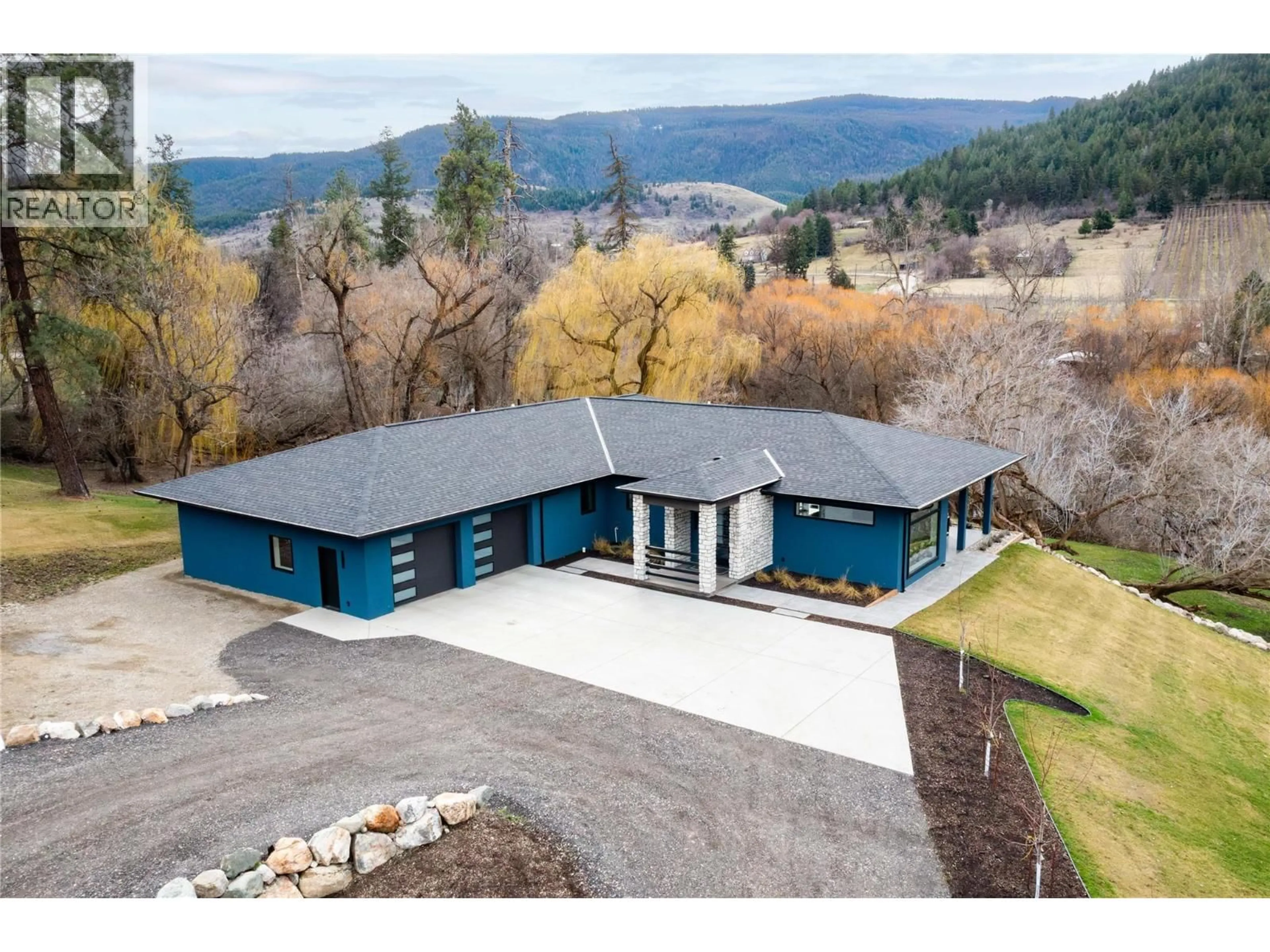 A pic from outside/outdoor area/front of a property/back of a property/a pic from drone, mountain view for 10202 KALAMALKA ROAD, Coldstream British Columbia V1B1L7