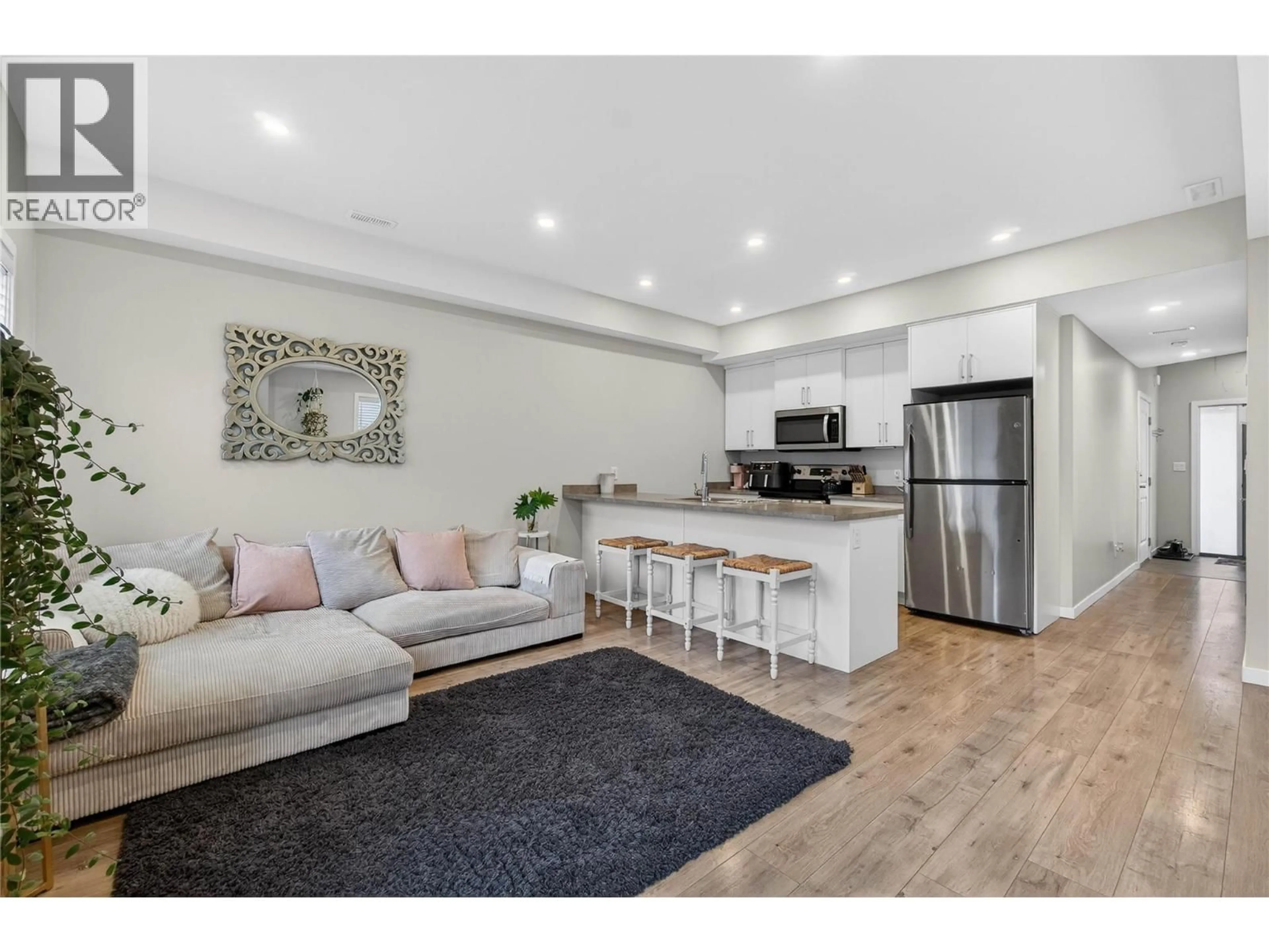 Open concept kitchen, wood/laminate floor for 12 - 2081 11 AVENUE NORTHEAST, Salmon Arm British Columbia V1E0G1