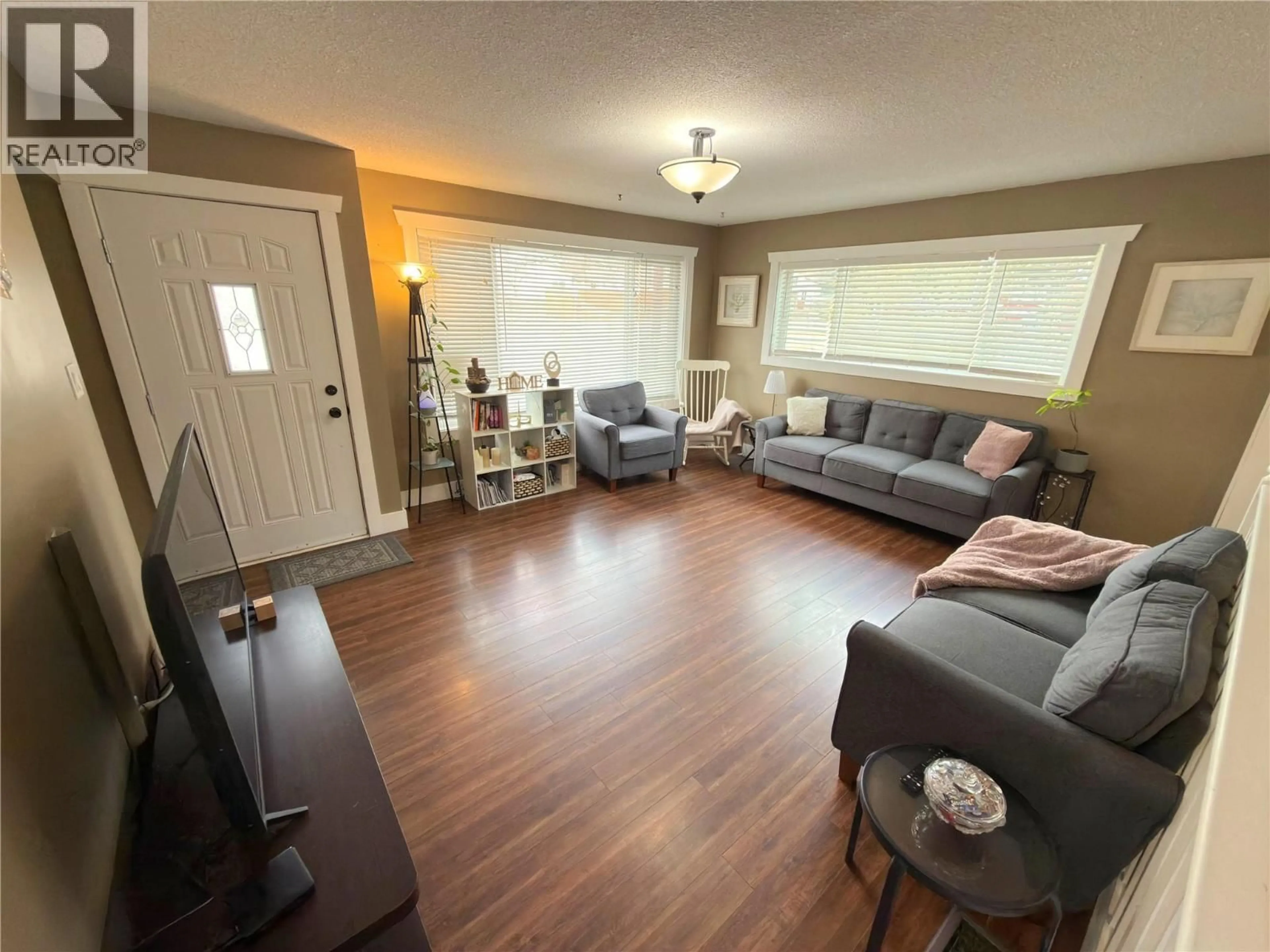 Living room with furniture, wood/laminate floor for 446 CORINA AVENUE, Princeton British Columbia V0X1W0
