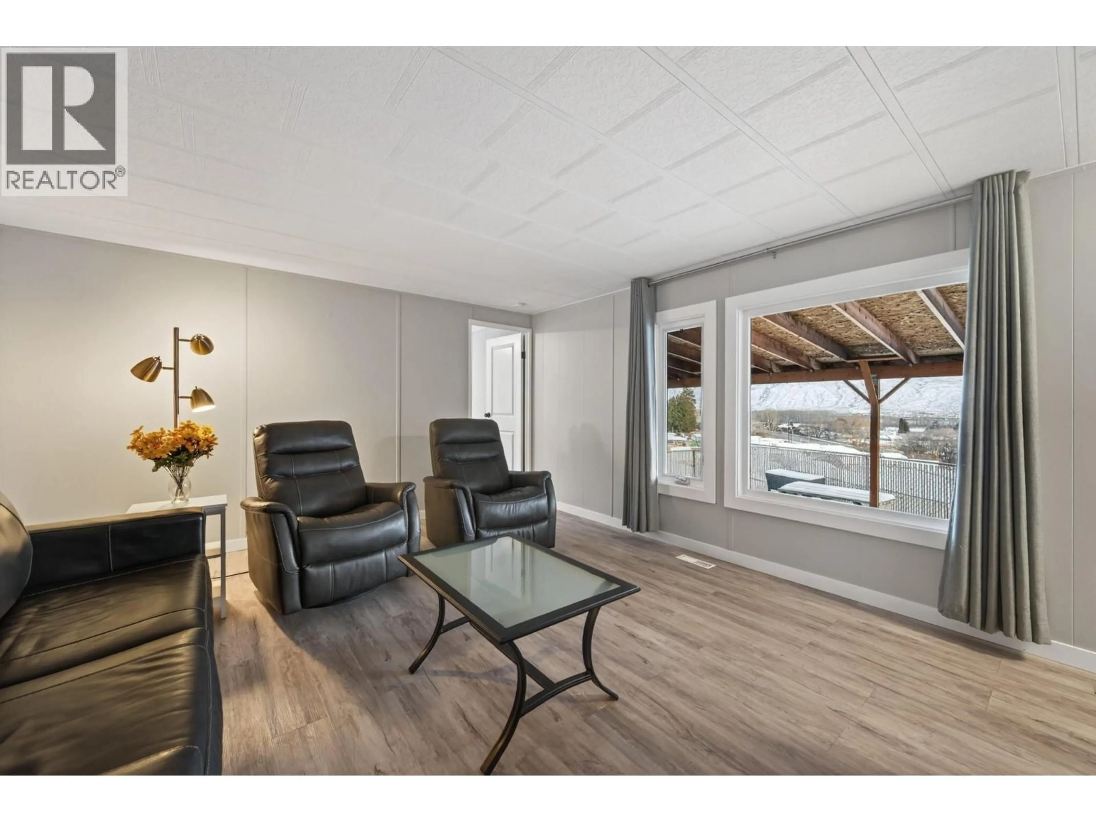 Living room with furniture, wood/laminate floor for 35 - 1680 WESTSYDE ROAD, Kamloops British Columbia V2B7B6