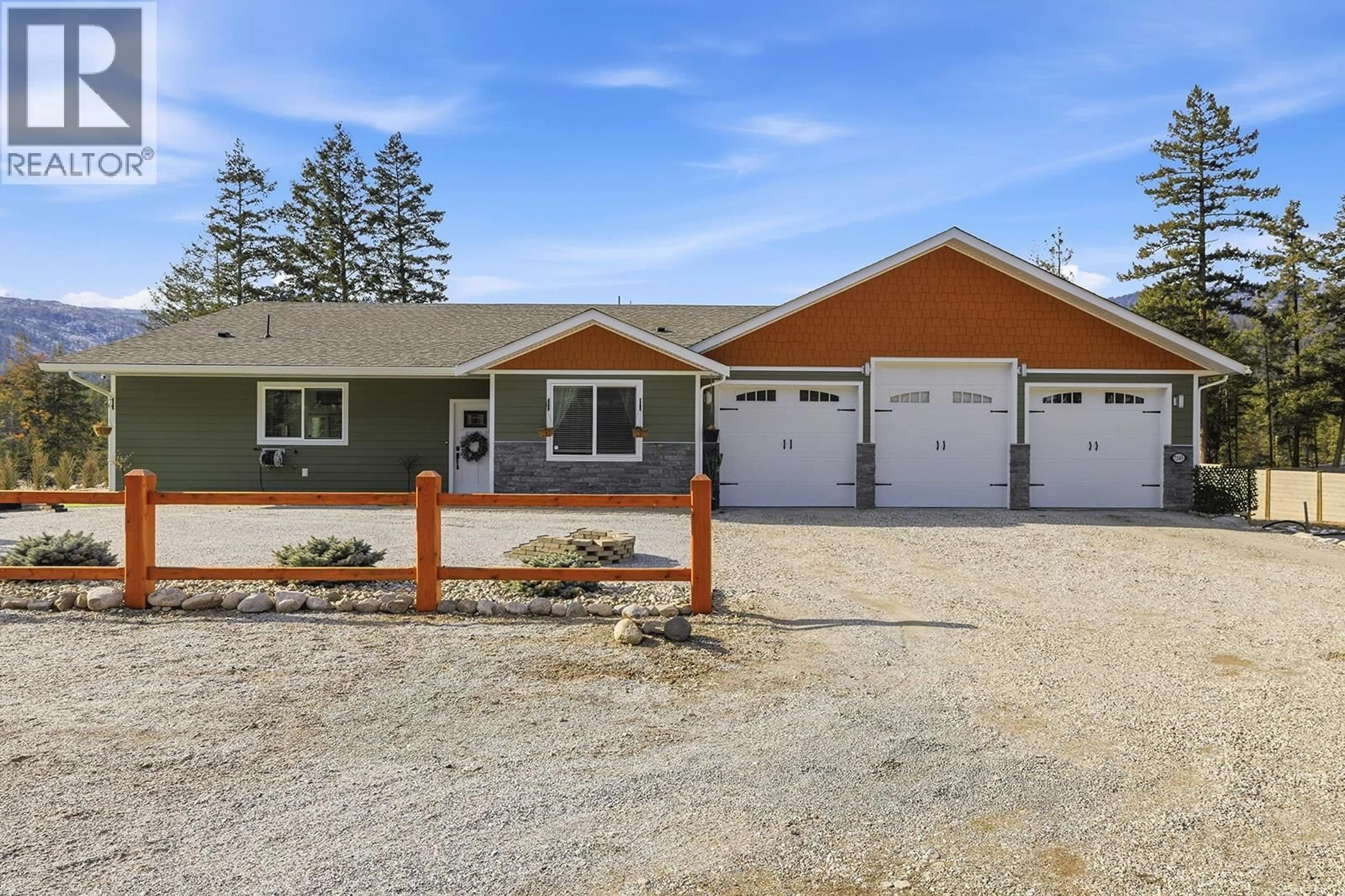 Home with vinyl exterior material, street for 7145 DUNWATERS ROAD, Kelowna British Columbia V1Z3W5