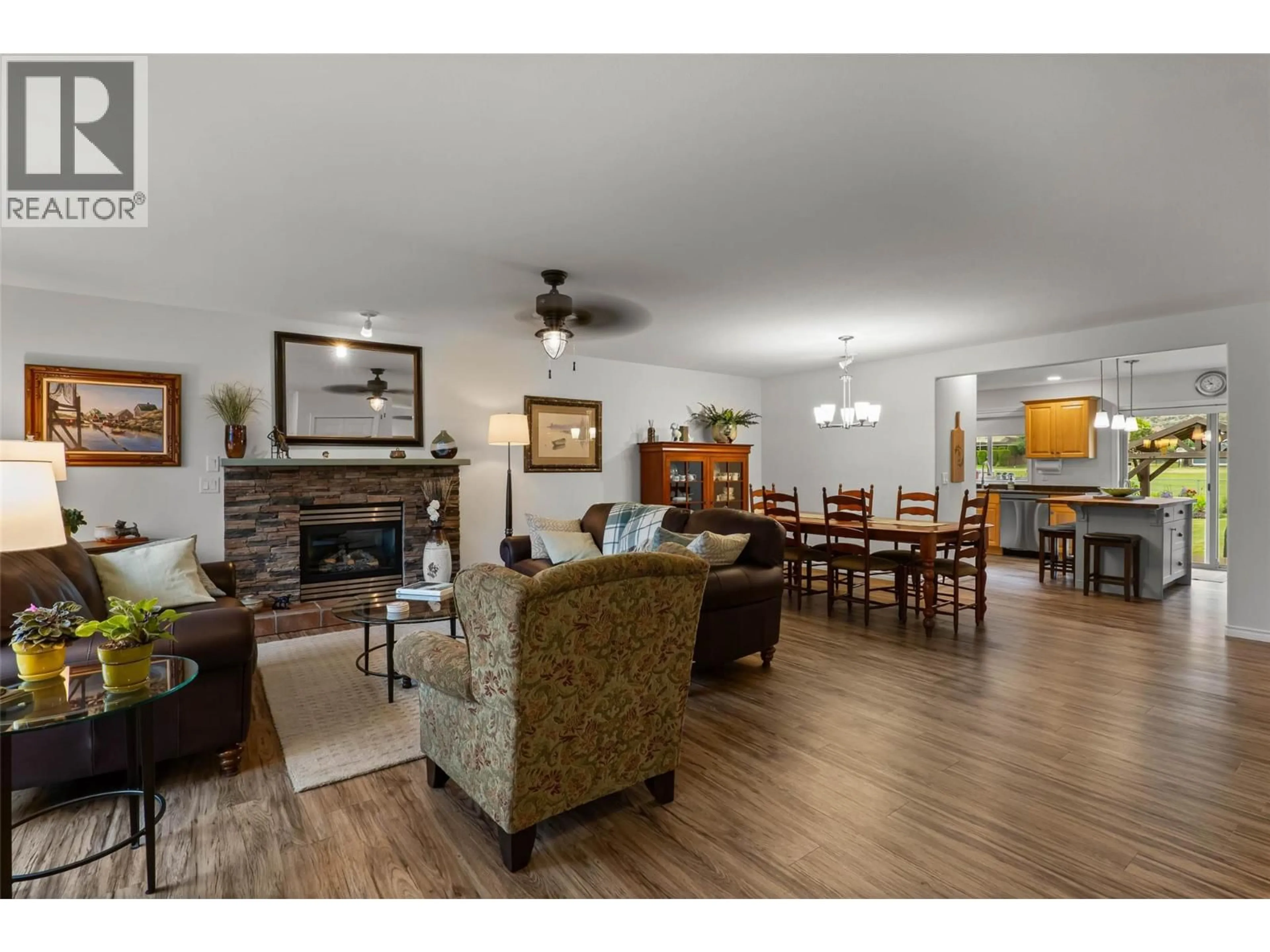 Living room with furniture, wood/laminate floor for 3712 NAVATANEE DRIVE, Kamloops British Columbia V2H1S1