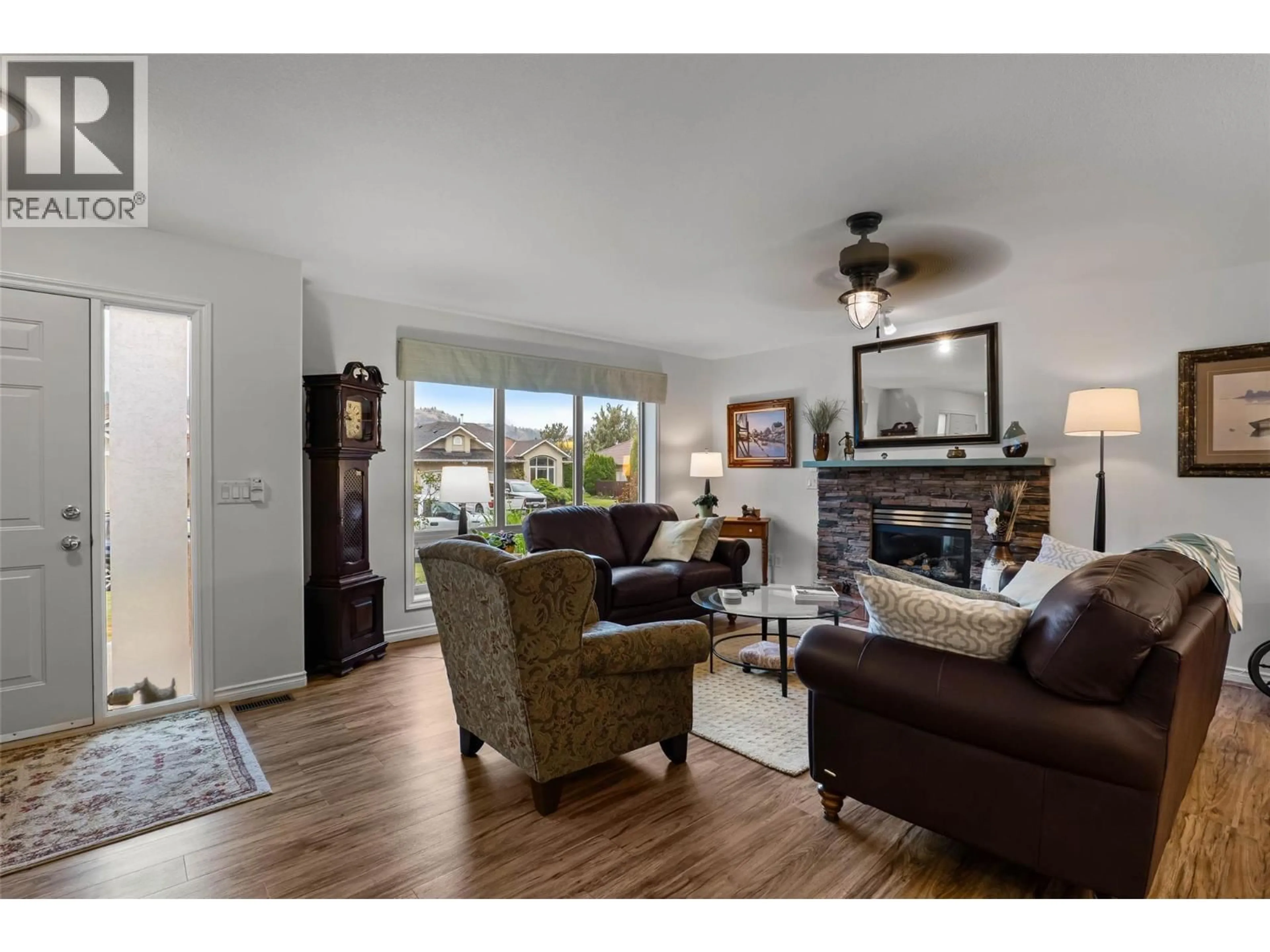 Living room with furniture, wood/laminate floor for 3712 NAVATANEE DRIVE, Kamloops British Columbia V2H1S1