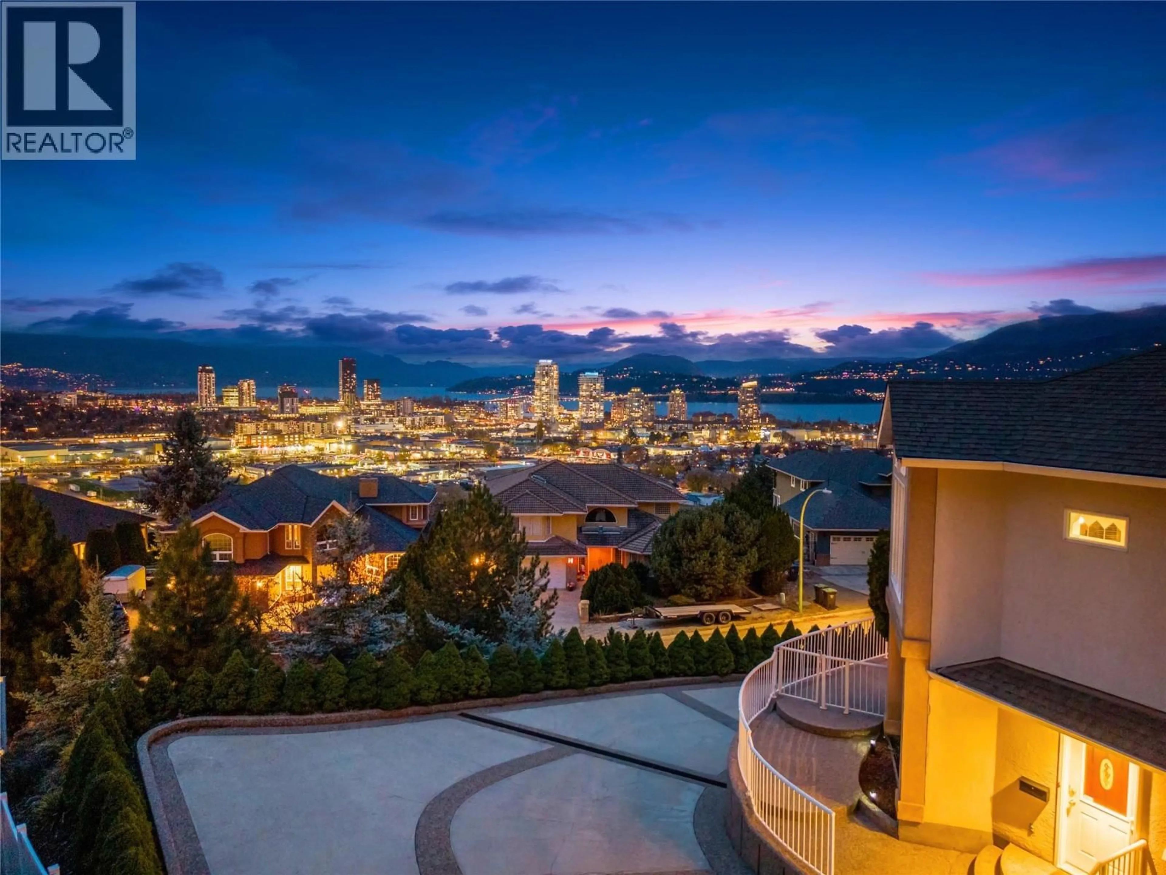 Patio, city buildings view from balcony for 705 ROYAL PINE DRIVE, Kelowna British Columbia V1Y9G2