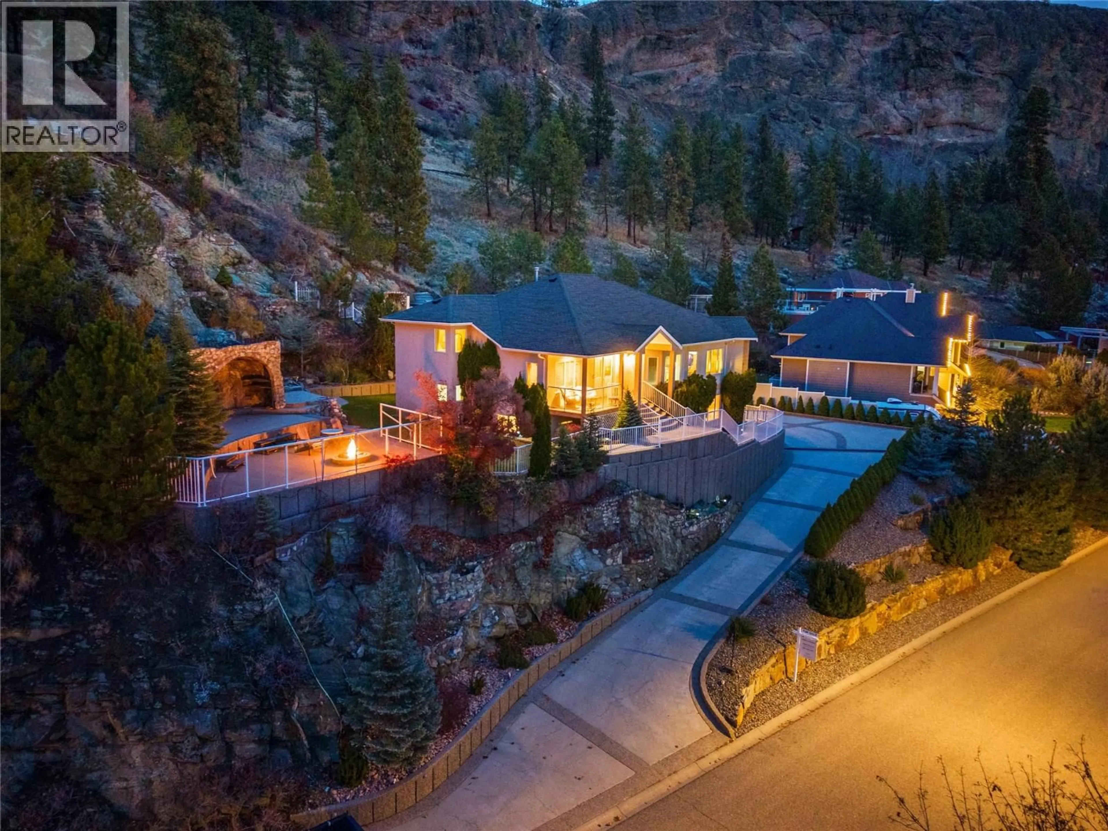 A pic from outside/outdoor area/front of a property/back of a property/a pic from drone, mountain view for 705 ROYAL PINE DRIVE, Kelowna British Columbia V1Y9G2