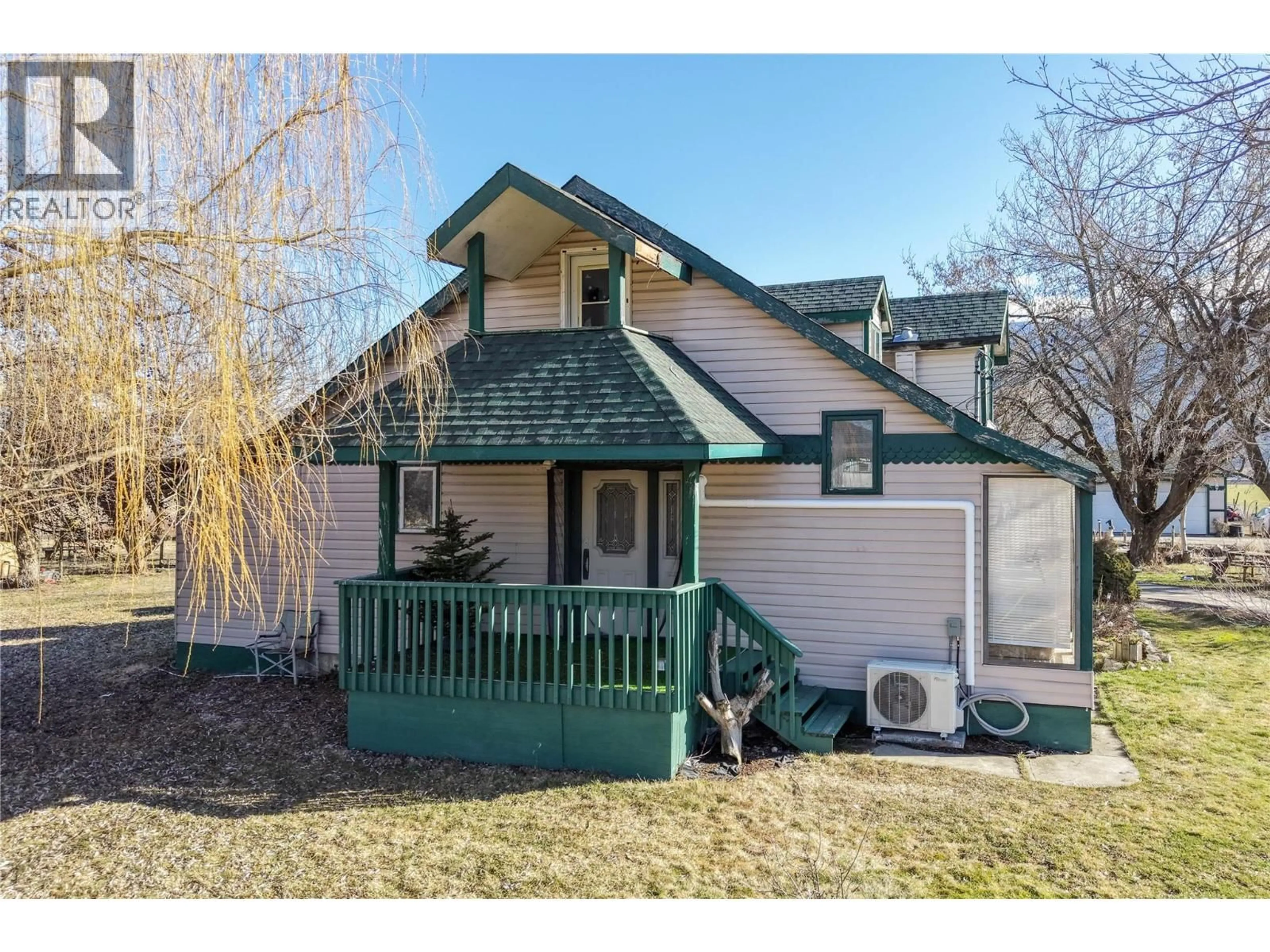 Home with vinyl exterior material, street for 1978 PLEASANT VALLEY ROAD, Spallumcheen British Columbia V4Y0T7