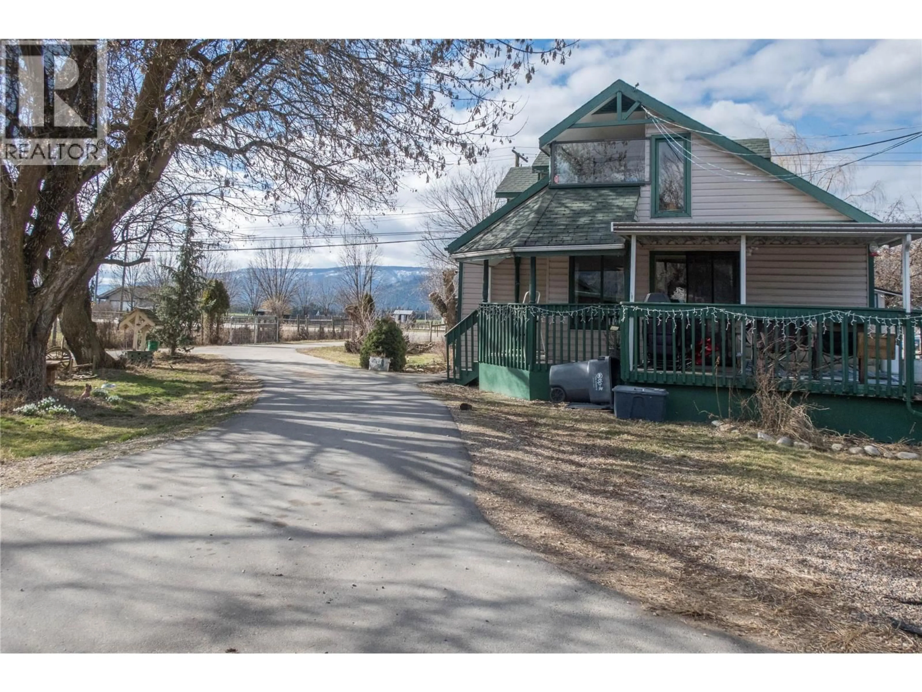 A pic from outside/outdoor area/front of a property/back of a property/a pic from drone, mountain view for 1978 PLEASANT VALLEY ROAD, Spallumcheen British Columbia V4Y0T7