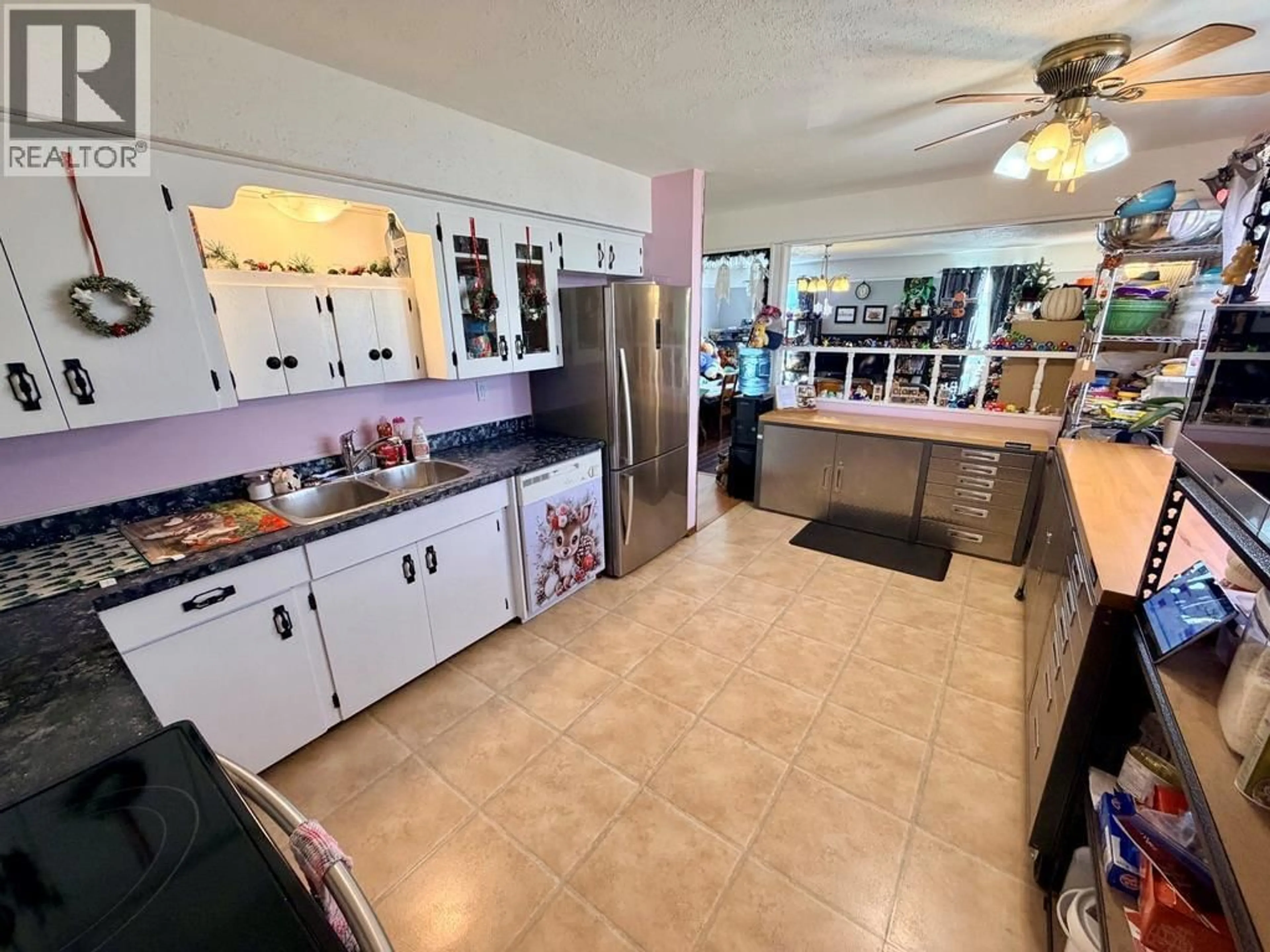 Open concept kitchen, ceramic/tile floor for 712 97A AVENUE, Dawson Creek British Columbia V1G1R3