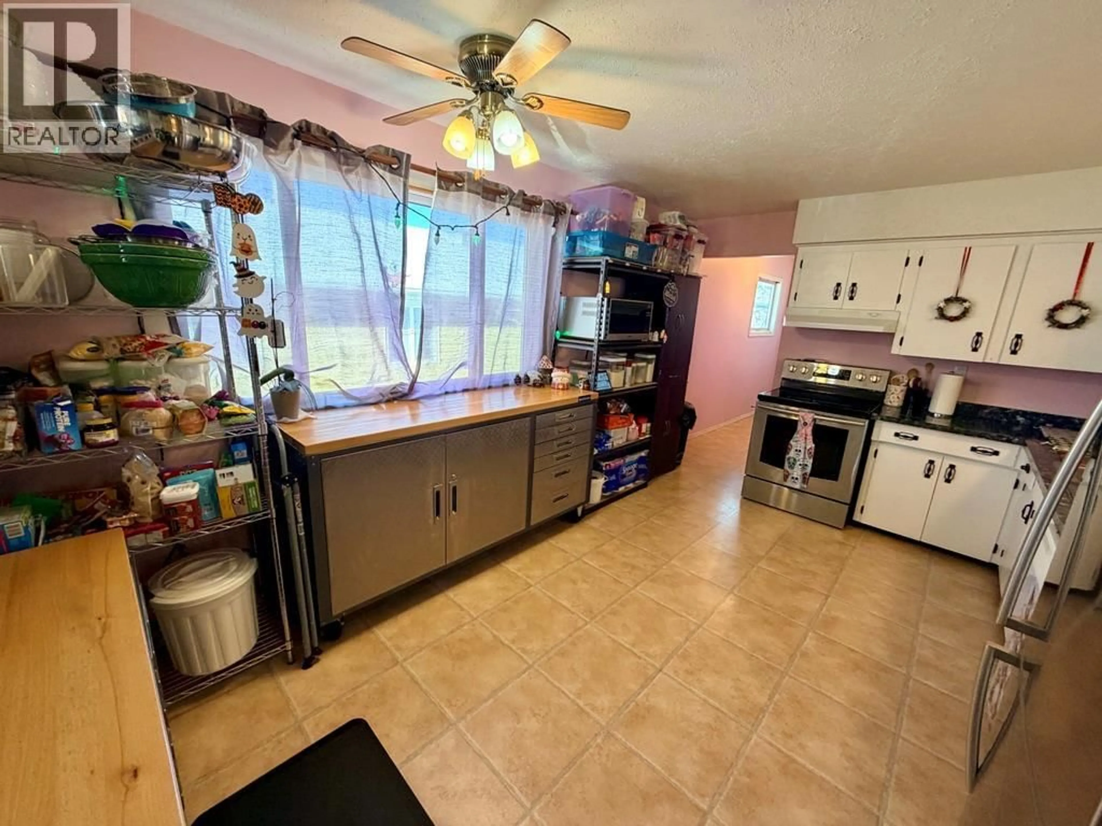 Open concept kitchen, ceramic/tile floor for 712 97A AVENUE, Dawson Creek British Columbia V1G1R3